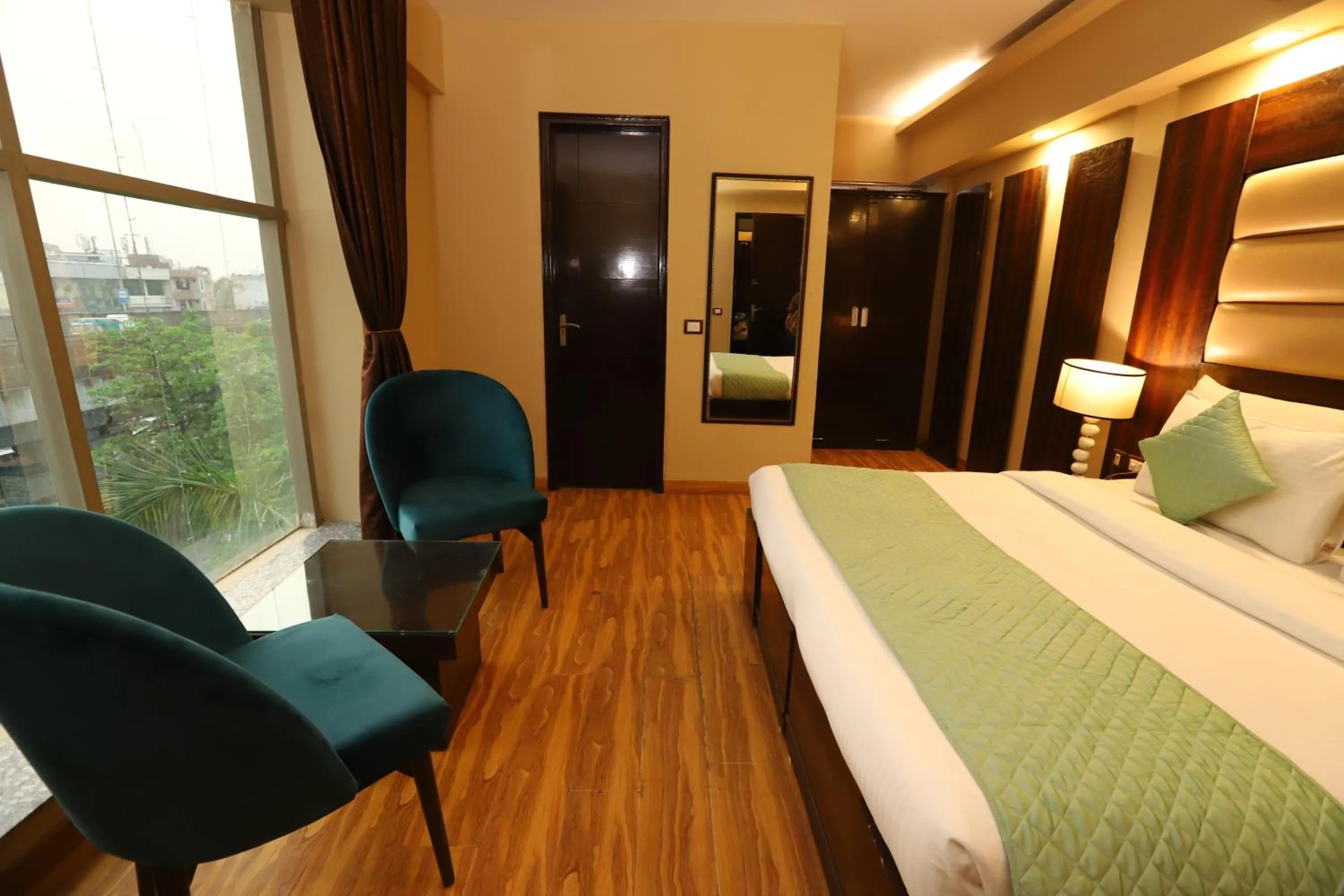 Photo of the whole room, Bed in Hotel Palm Grand Naraina New Delhi - Couple Friendly Local IDs Accepted