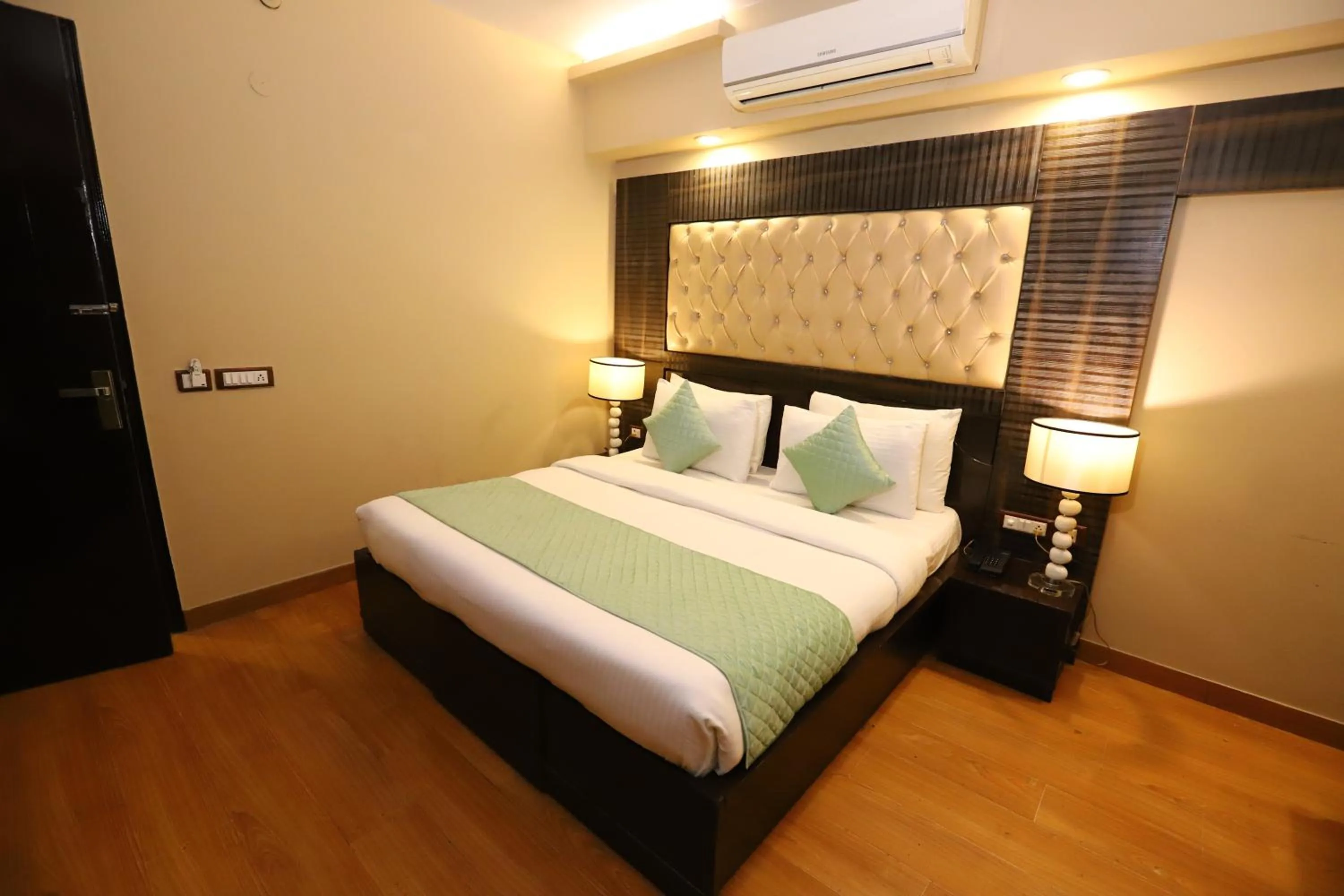 Photo of the whole room, Bed in Hotel Palm Grand Naraina New Delhi - Couple Friendly Local IDs Accepted