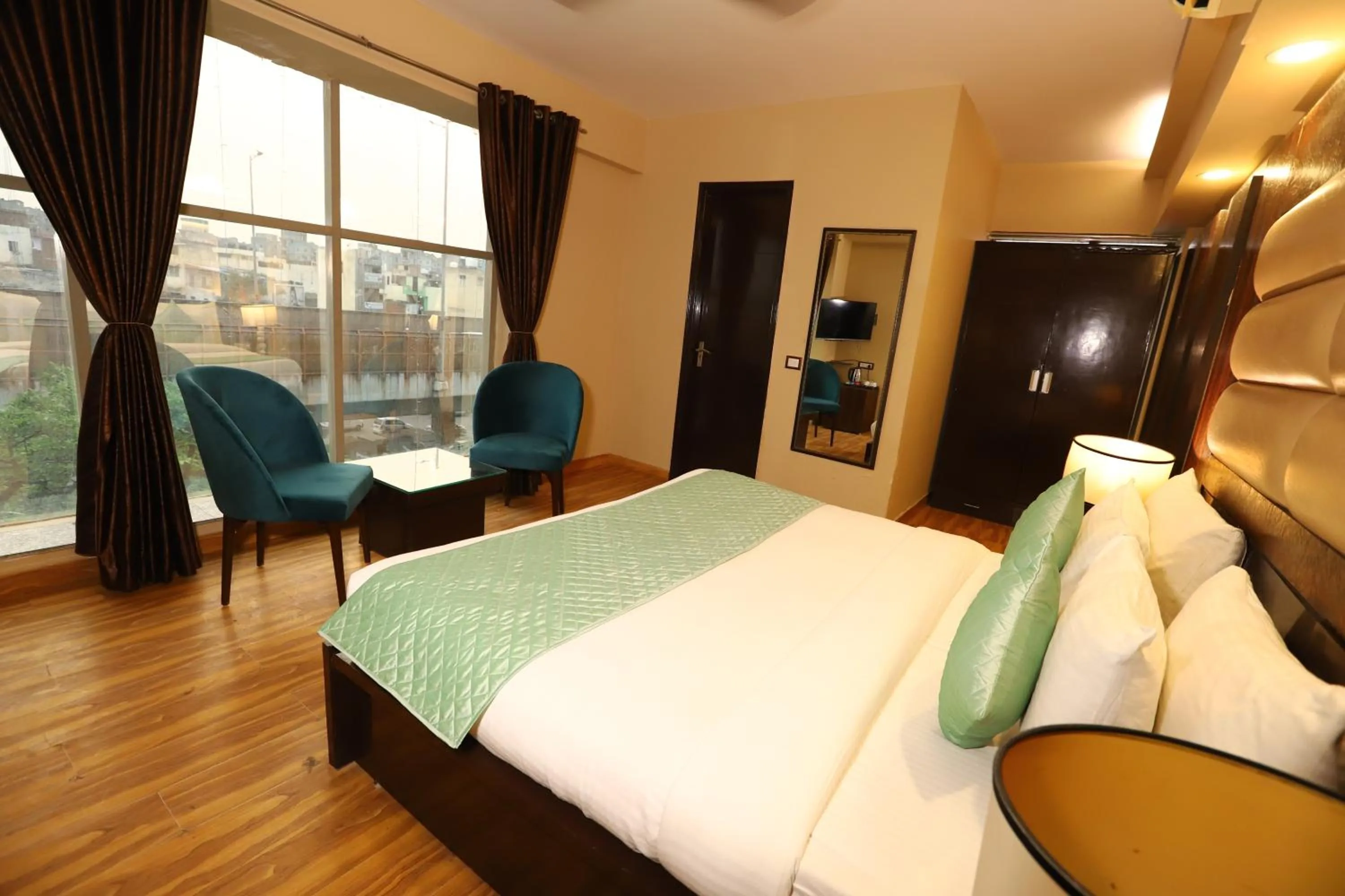 Photo of the whole room, Bed in Hotel Palm Grand Naraina New Delhi - Couple Friendly Local IDs Accepted