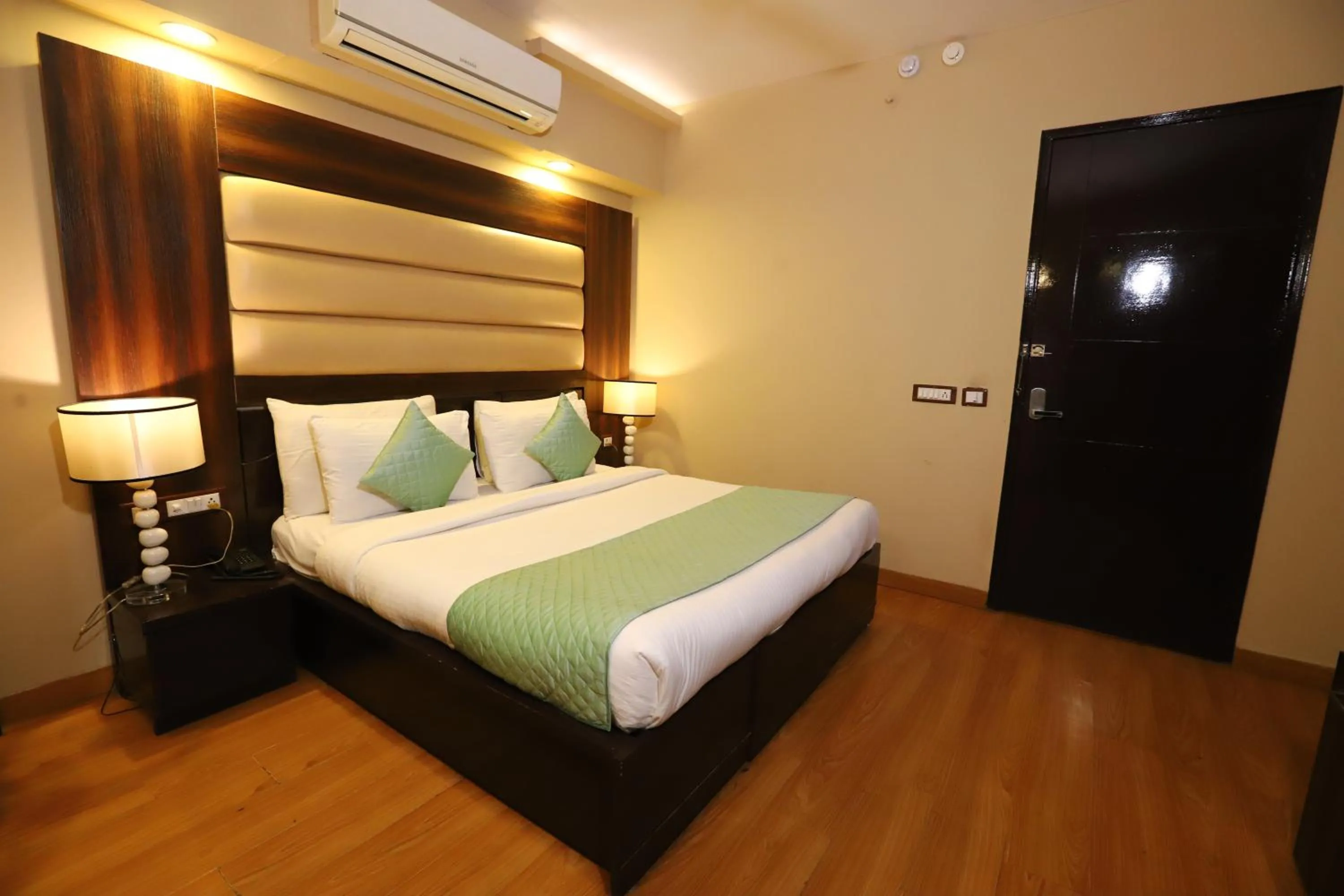 Photo of the whole room, Bed in Hotel Palm Grand Naraina New Delhi - Couple Friendly Local IDs Accepted