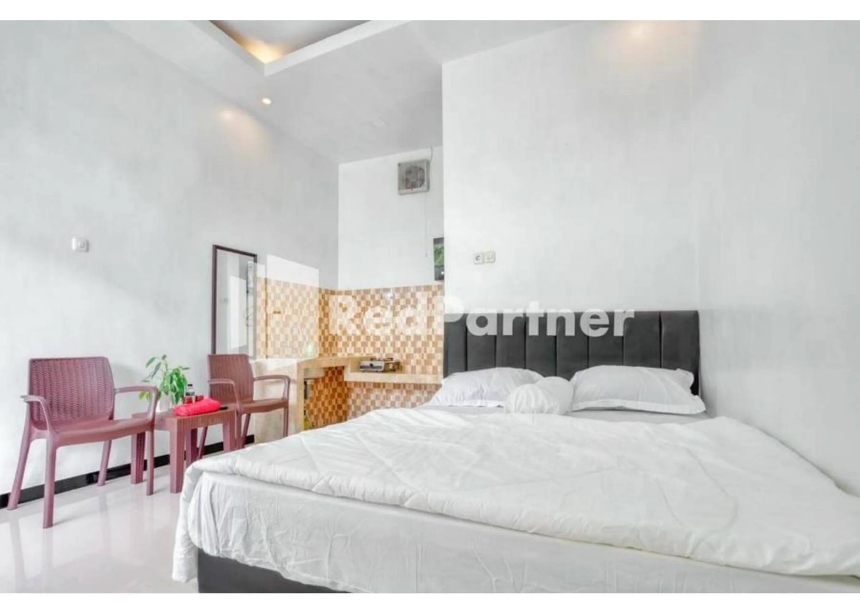 Bed in Griya Rahayu Guesthouse Mitra RedDoorz near Jatim Park 2 Batu