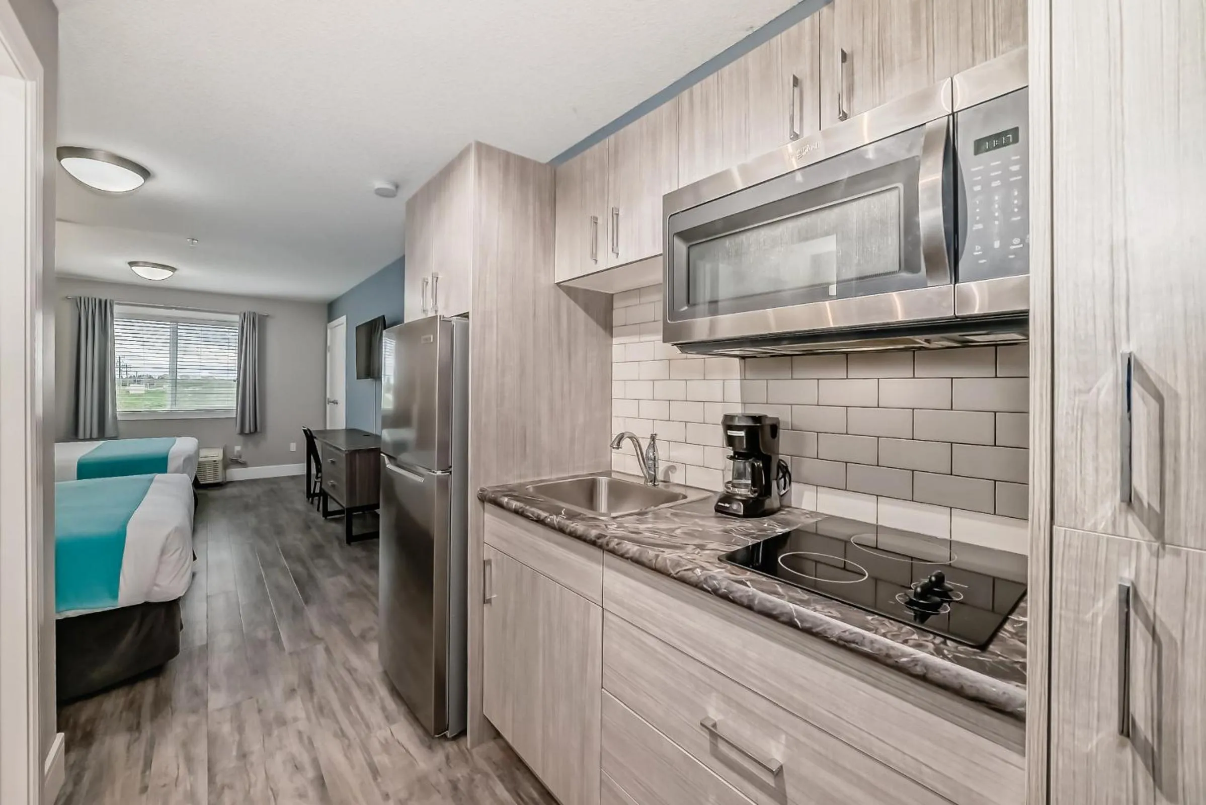 Kitchen or kitchenette in The Suites, INN Hotels