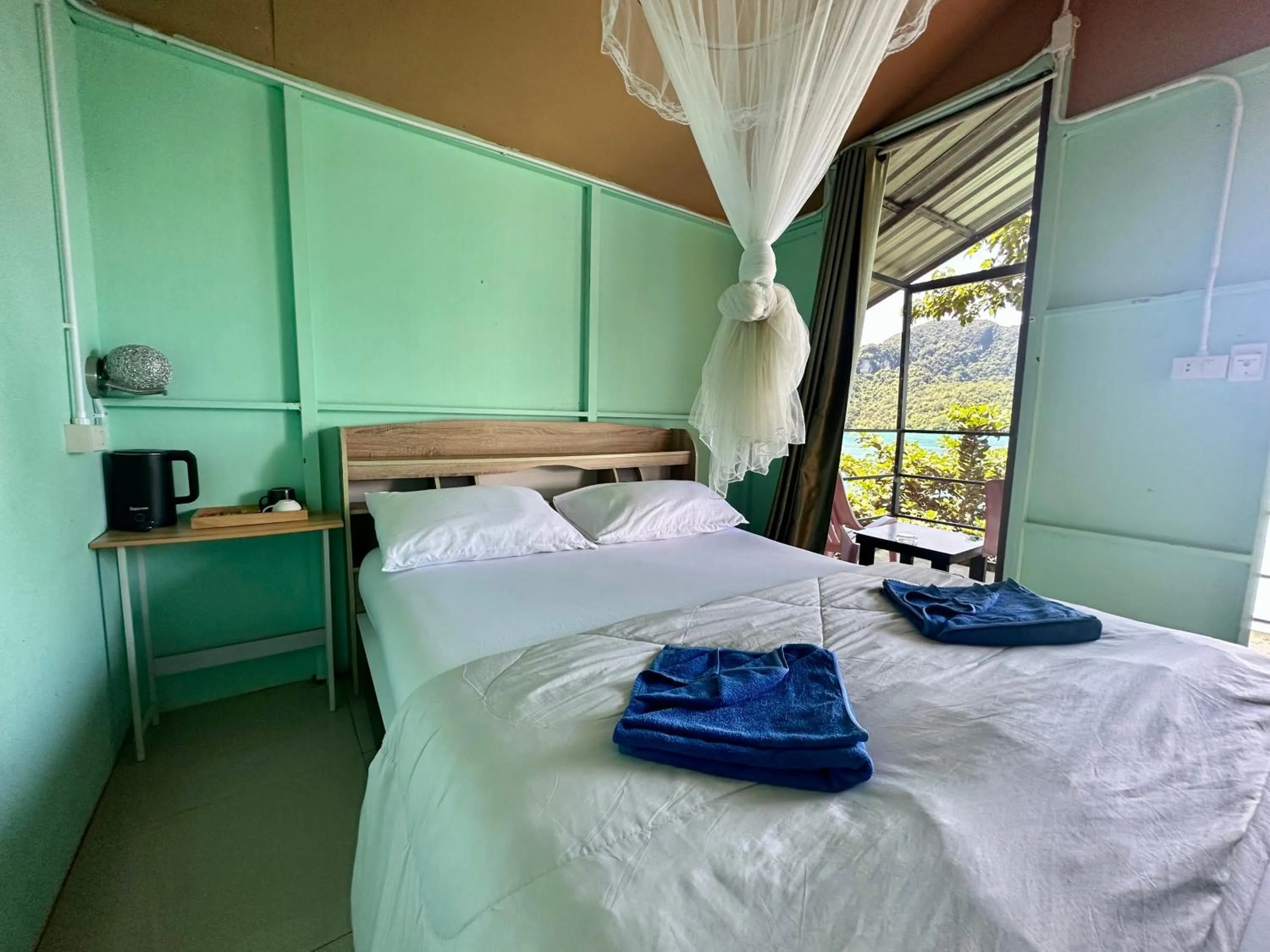 Bed in Phi Phi Seaside Bungalow