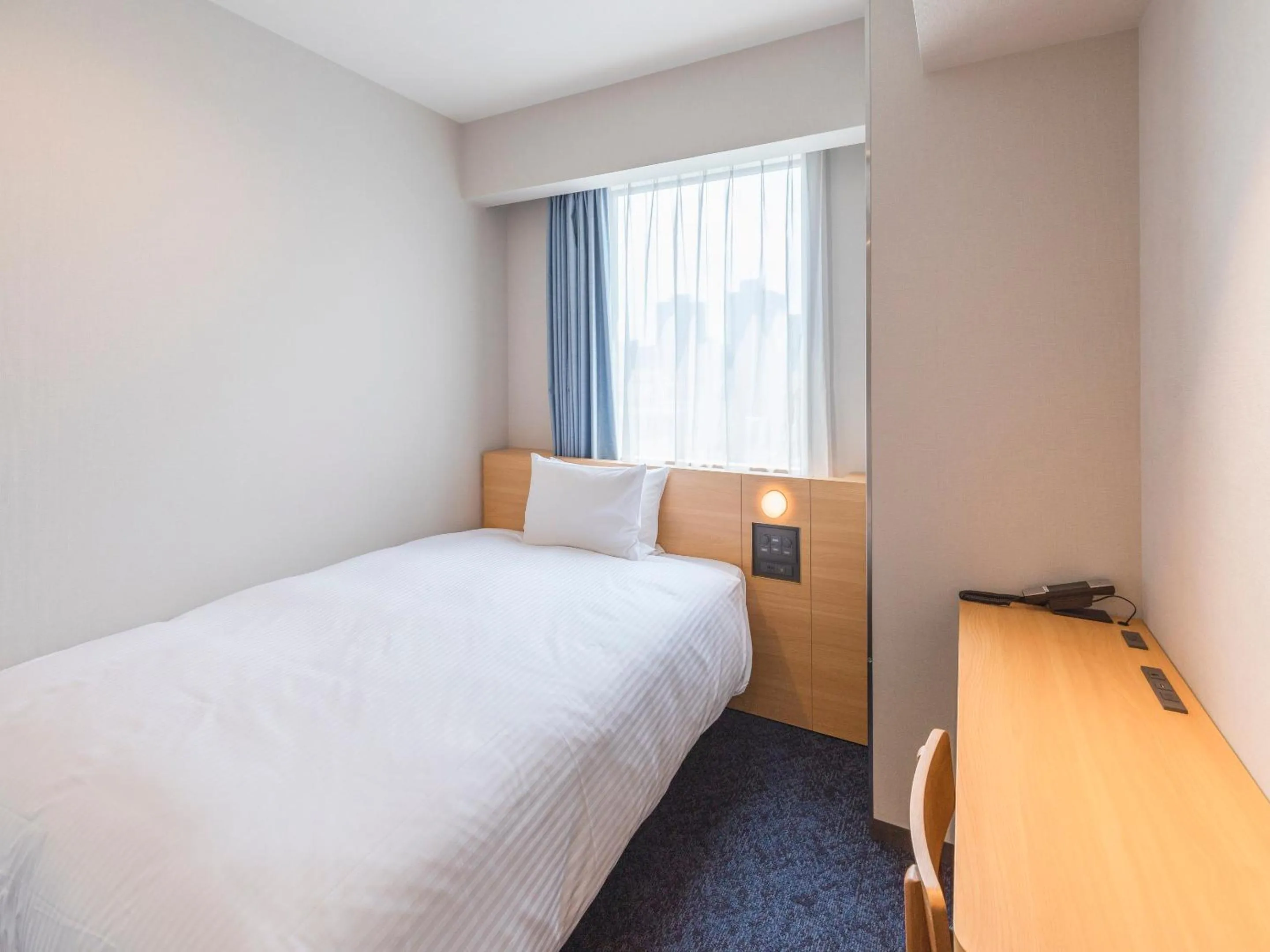 Bed in Sotetsu Fresa Inn Sendai