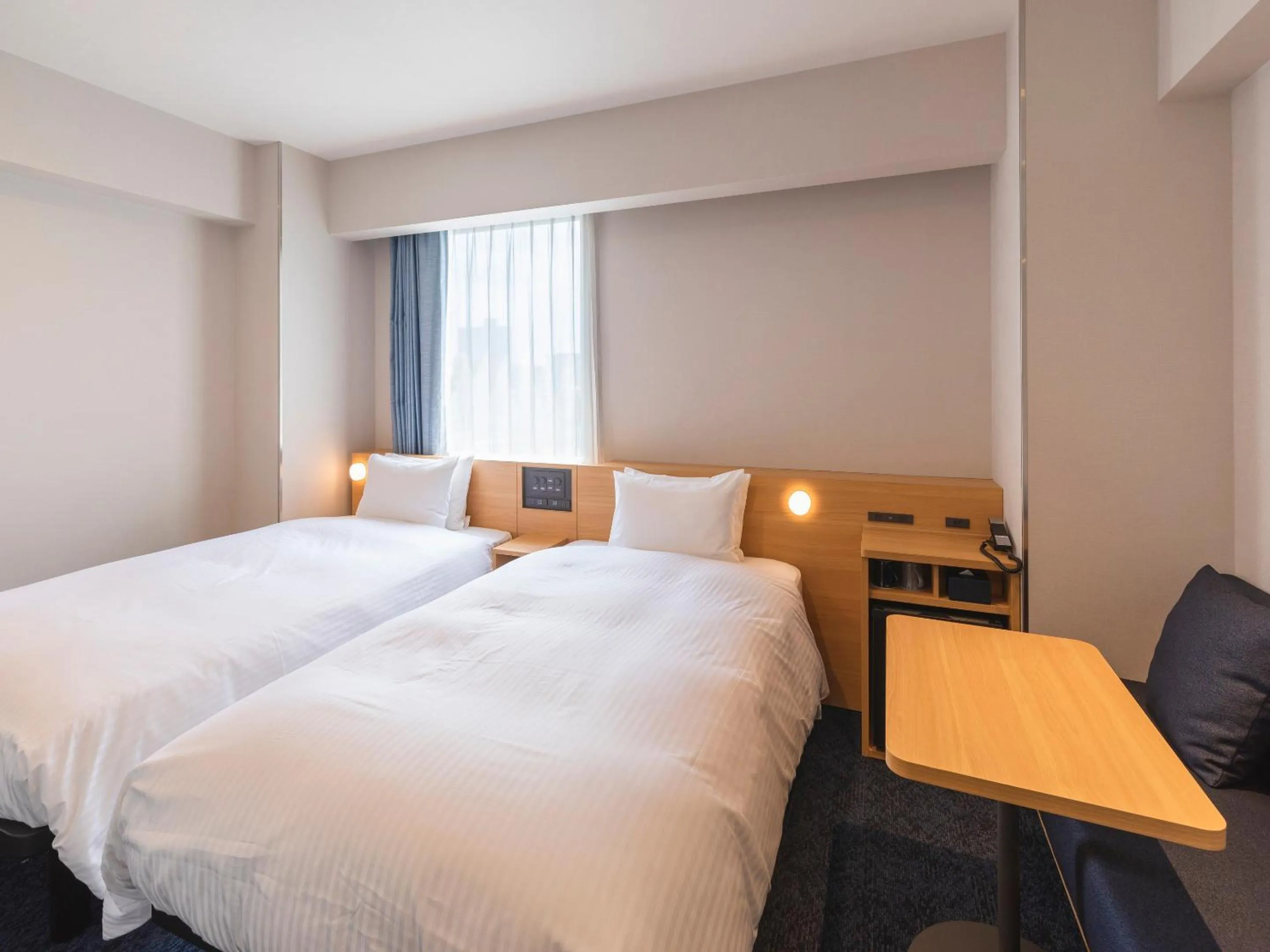 Bed in Sotetsu Fresa Inn Sendai