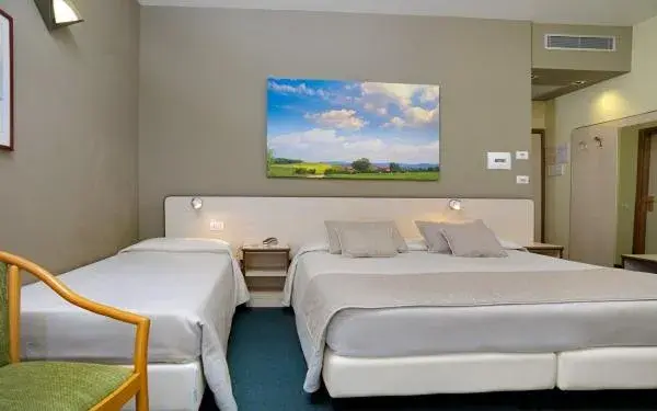 Quadruple Room in Hotel Ristorante Alcide Quadruple Room in Hotel Ristorante Alcide