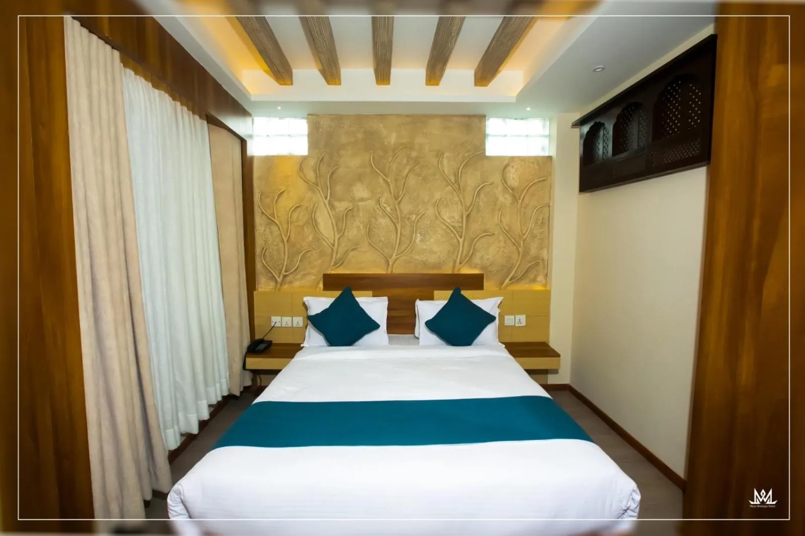 Bed in Maya Boutique Hotel