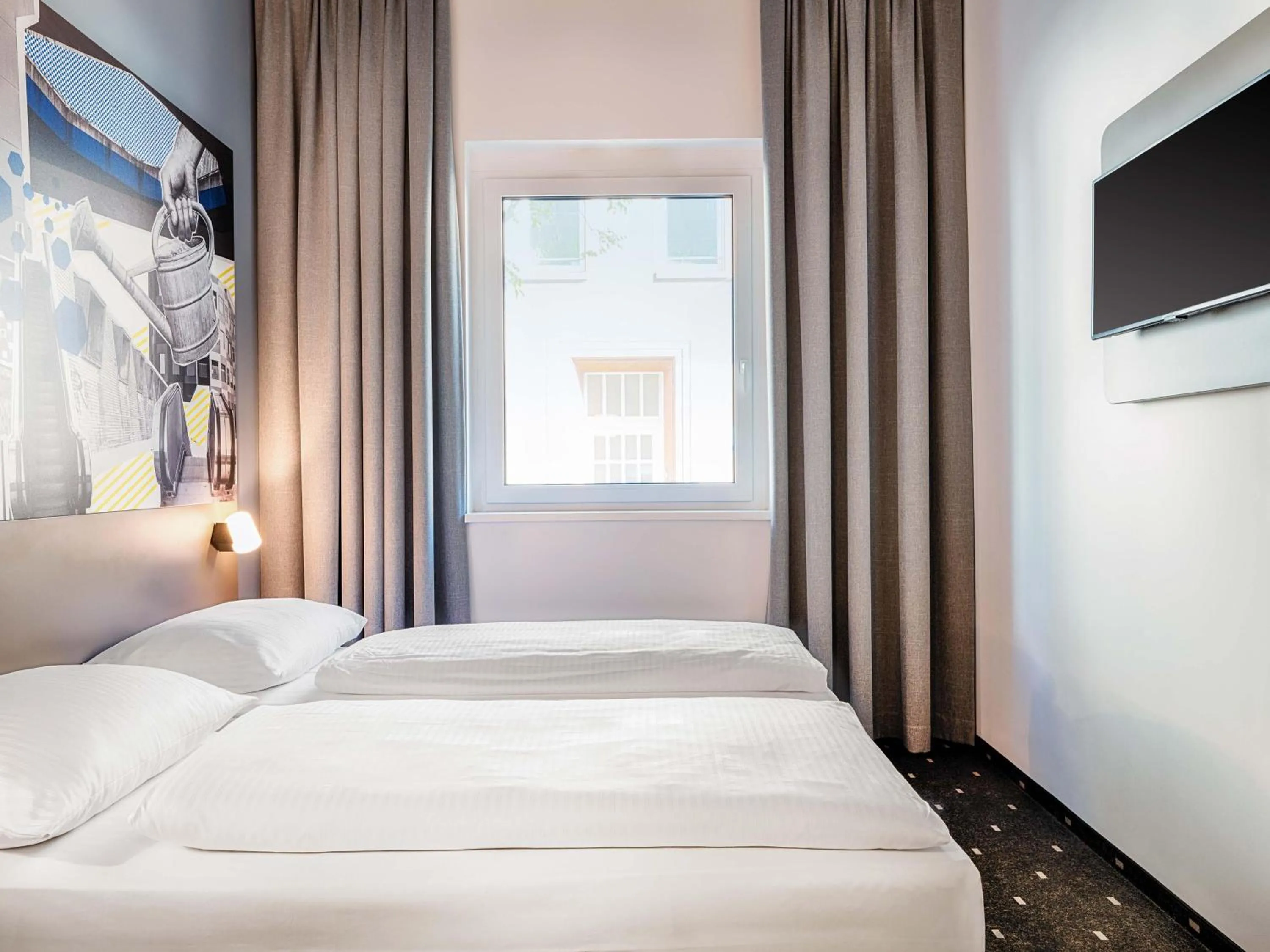 Photo of the whole room, Bed in B&B HOTEL Gießen-City