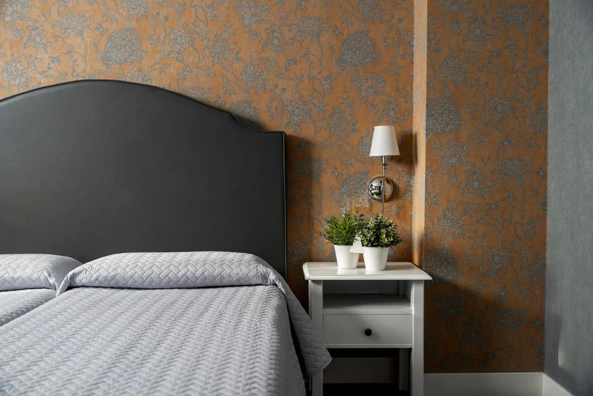 Bed in Maxxim Hotel & Loft