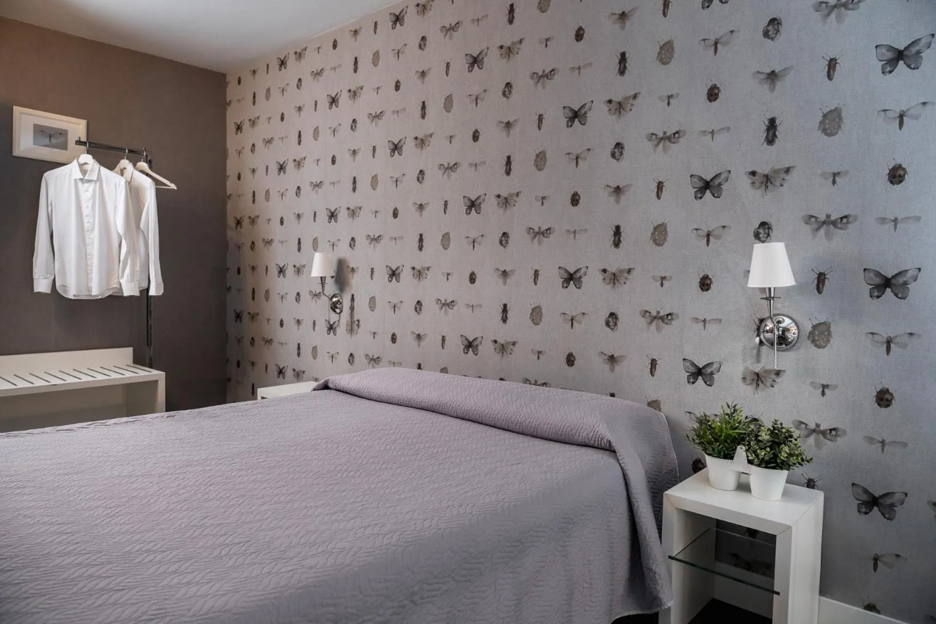 Bed in Maxxim Hotel & Loft