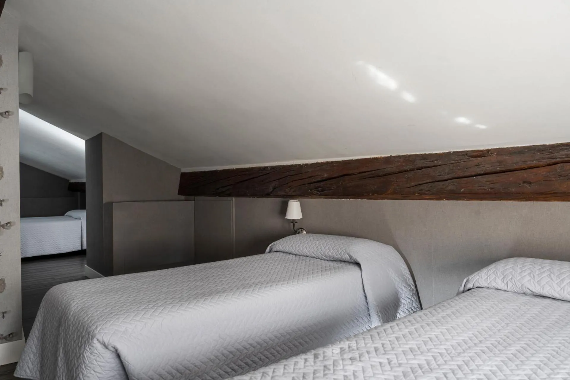 Bed in Maxxim Hotel & Loft