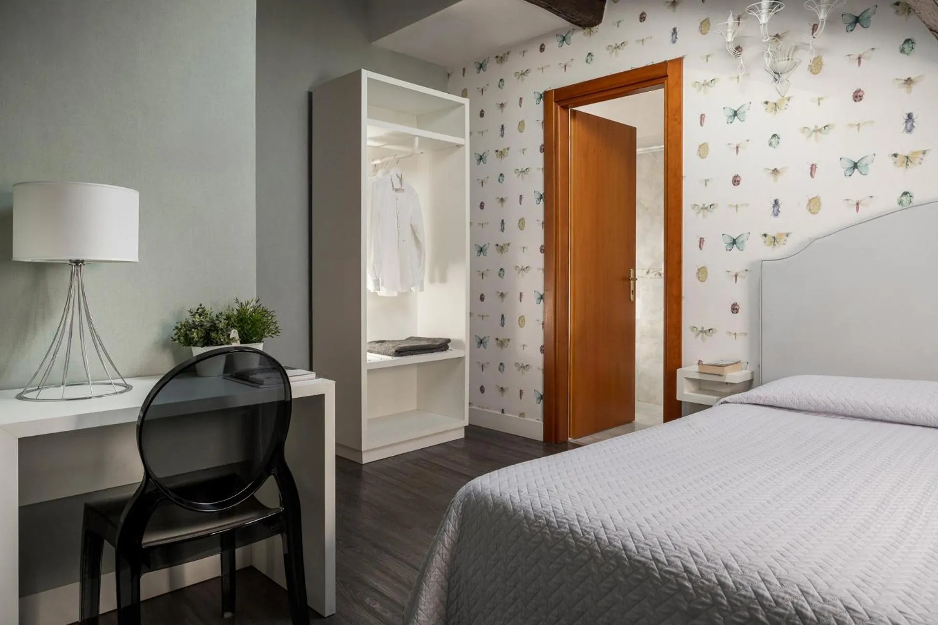 Bed in Maxxim Hotel & Loft