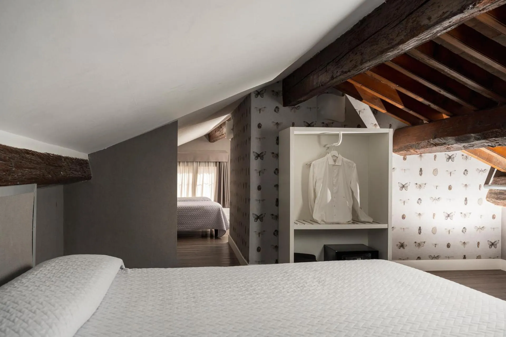 Bed in Maxxim Hotel & Loft