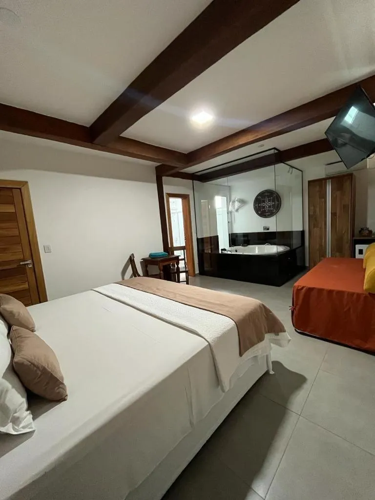 Bed in Pousada Mar Mineiro Macacos