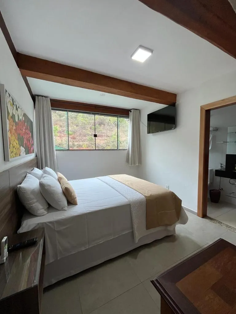 Bed in Pousada Mar Mineiro Macacos