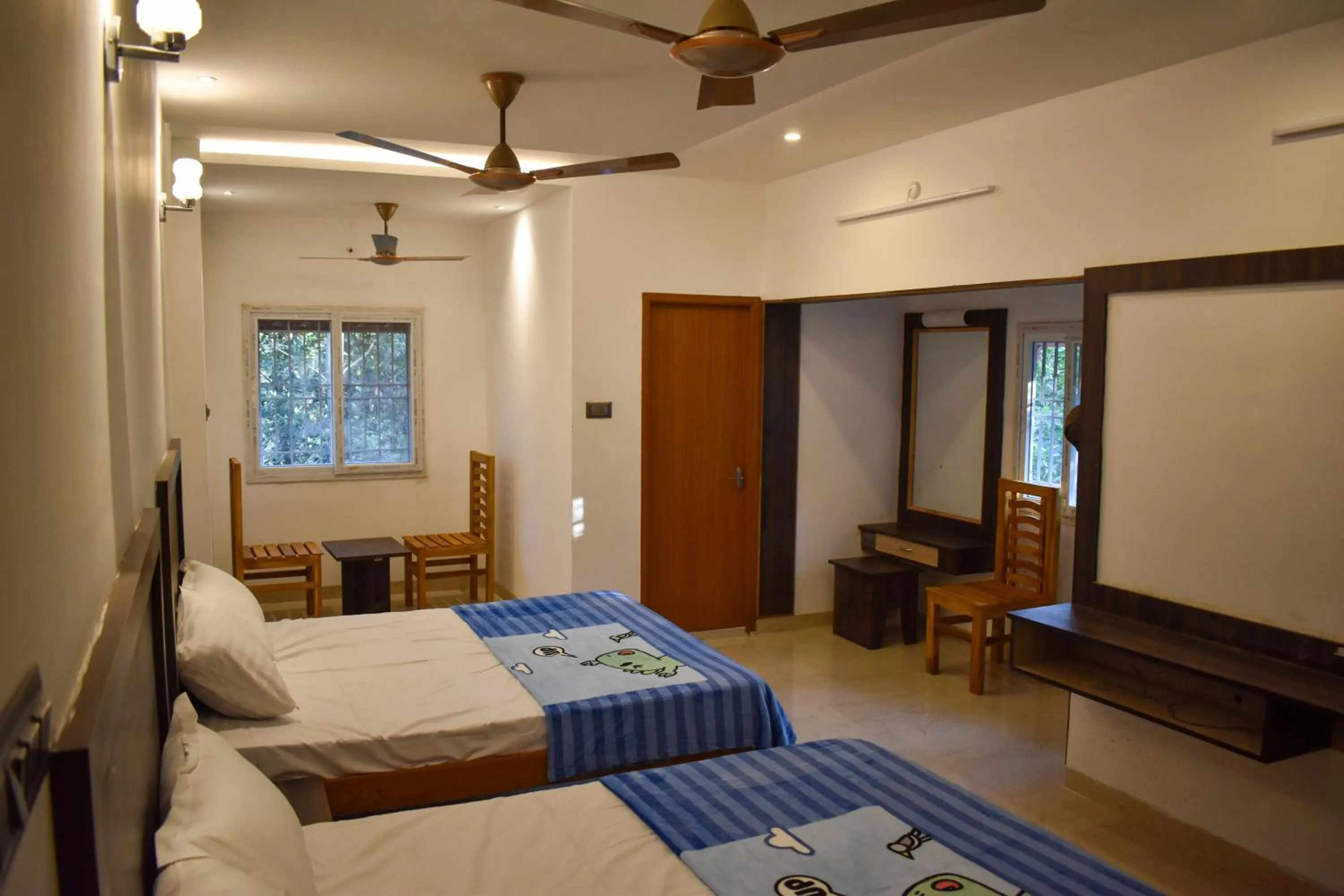 Bed in Bhavan Resorts