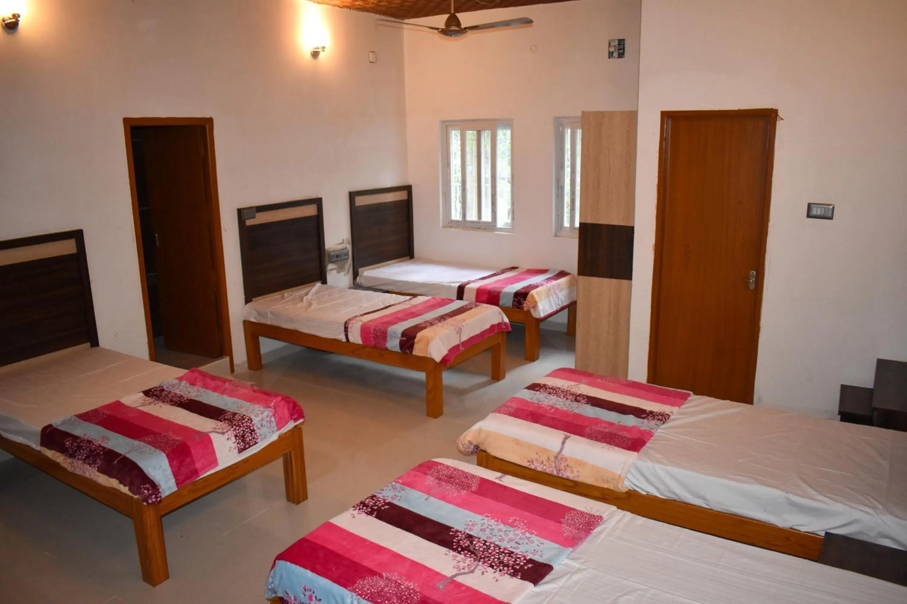 Bed in Bhavan Resorts