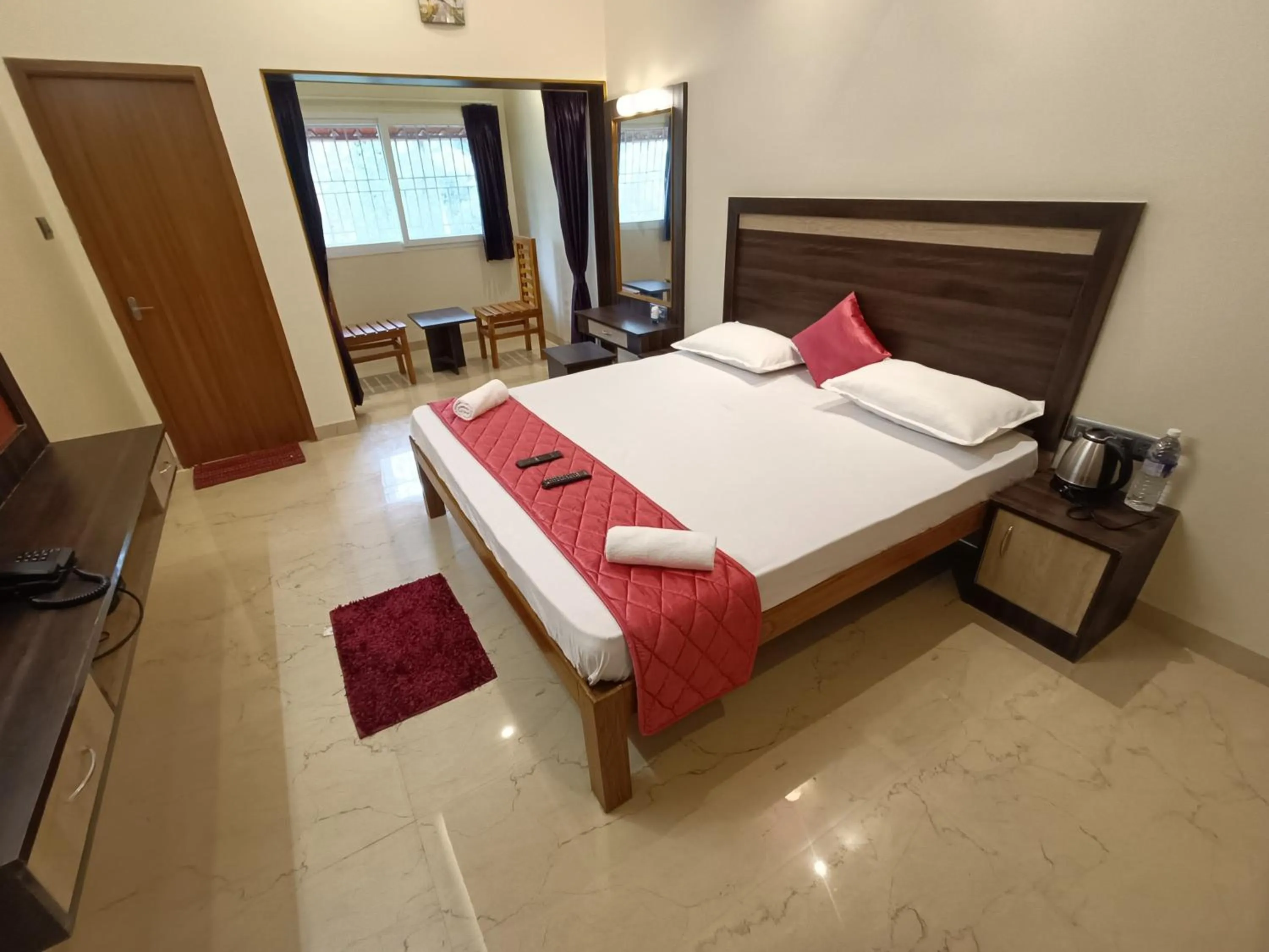 Photo of the whole room, Bed in Bhavan Resorts