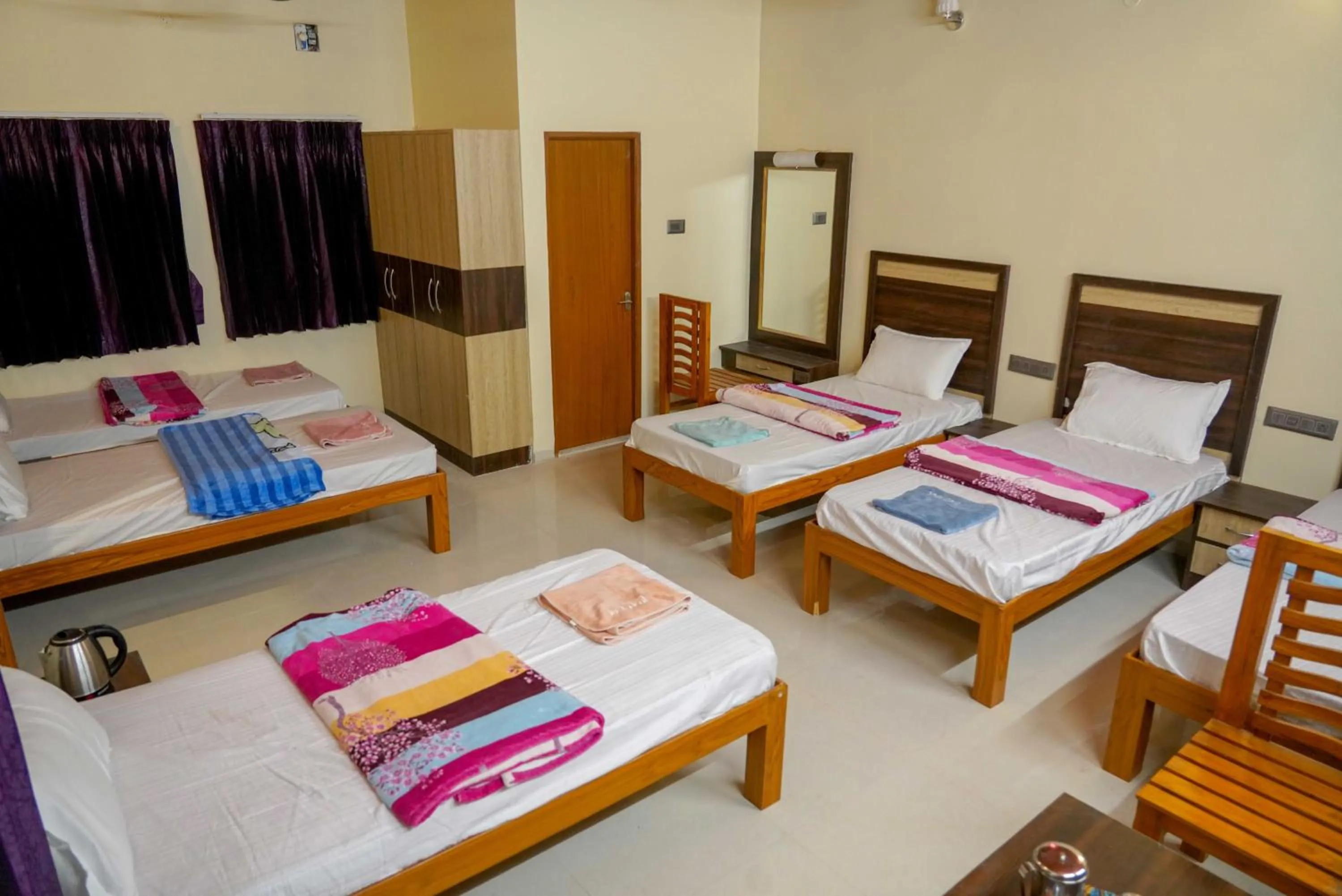 Bed in Bhavan Resorts