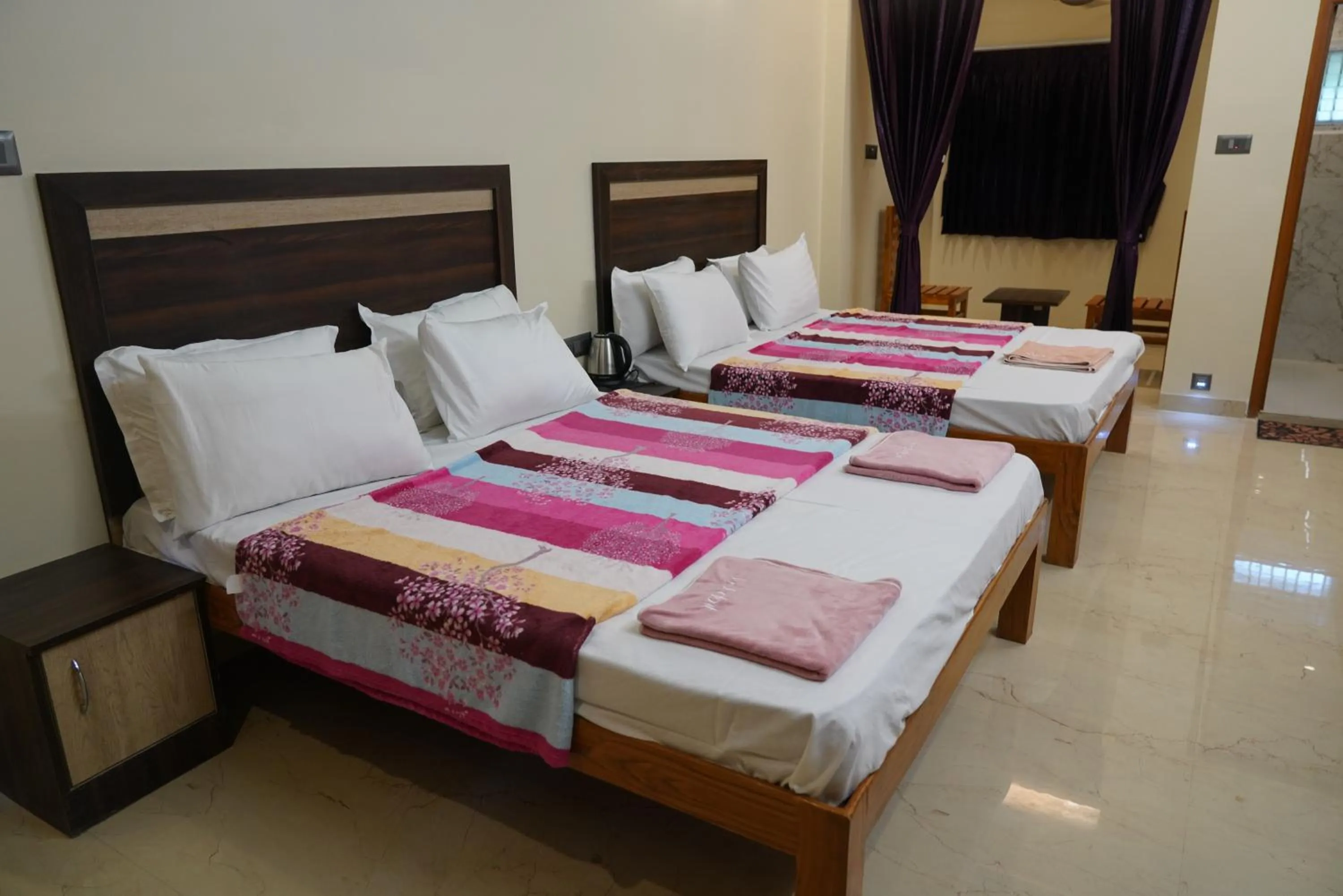 Bed in Bhavan Resorts