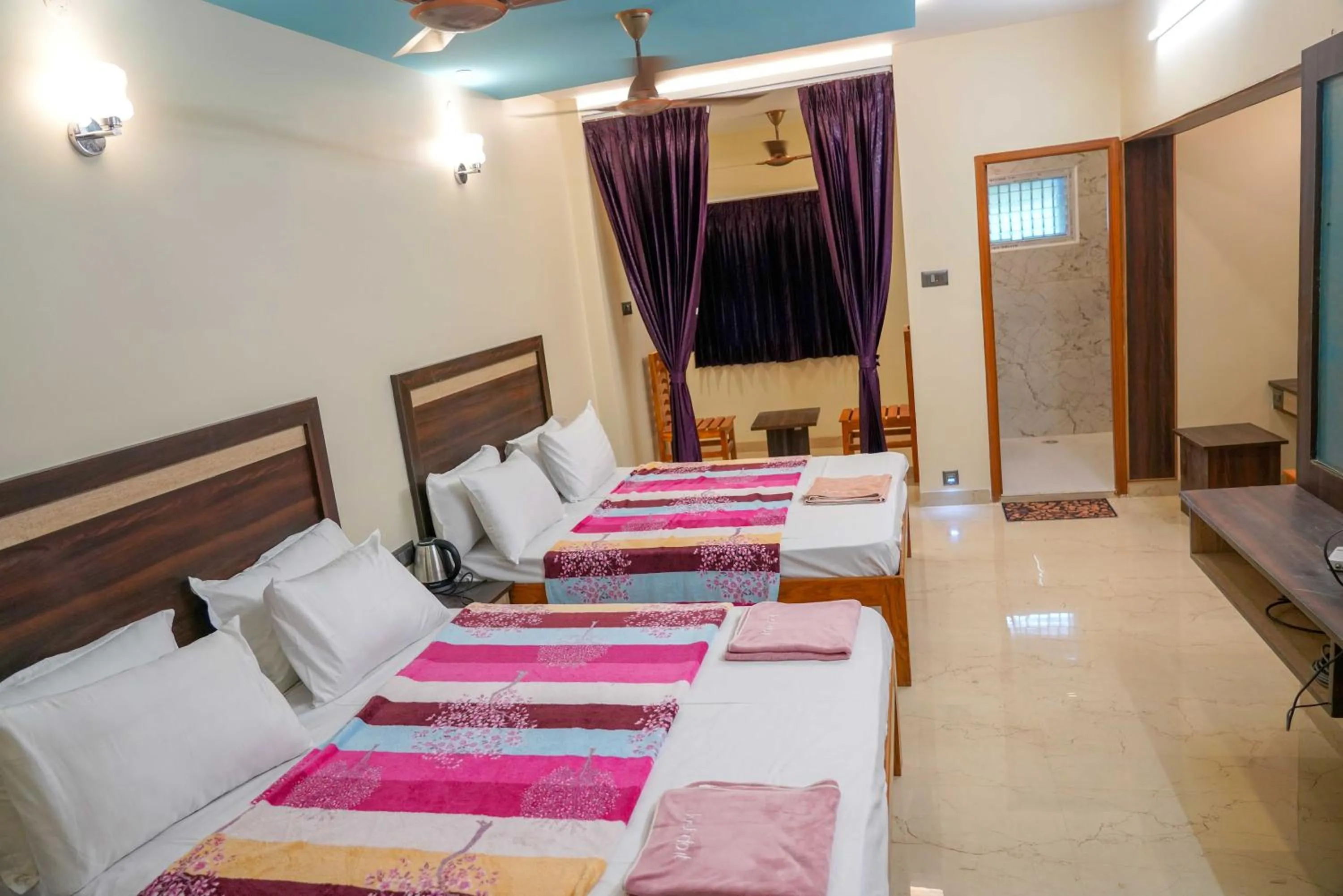 Bed in Bhavan Resorts