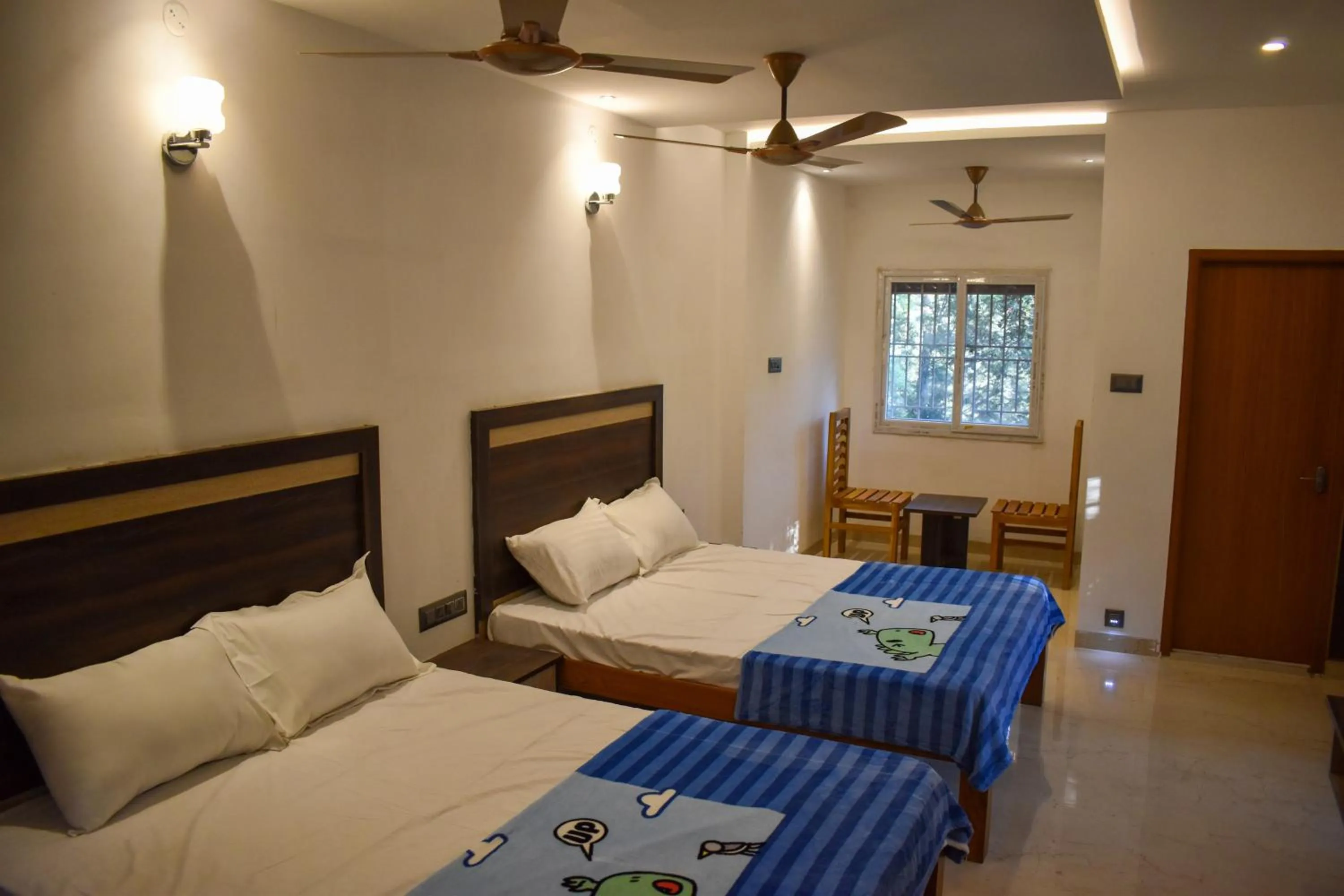 Bed in Bhavan Resorts