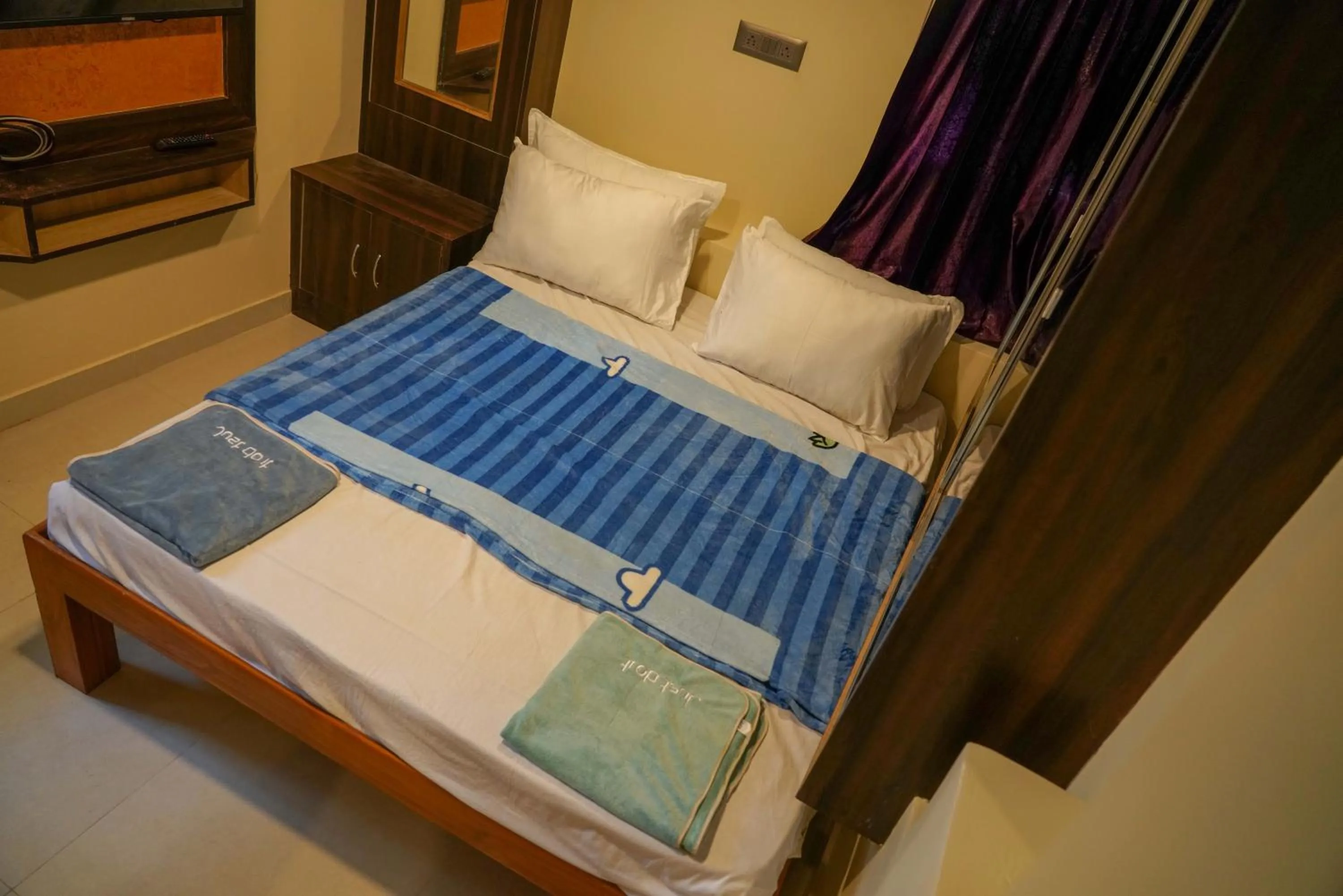 Bed in Bhavan Resorts