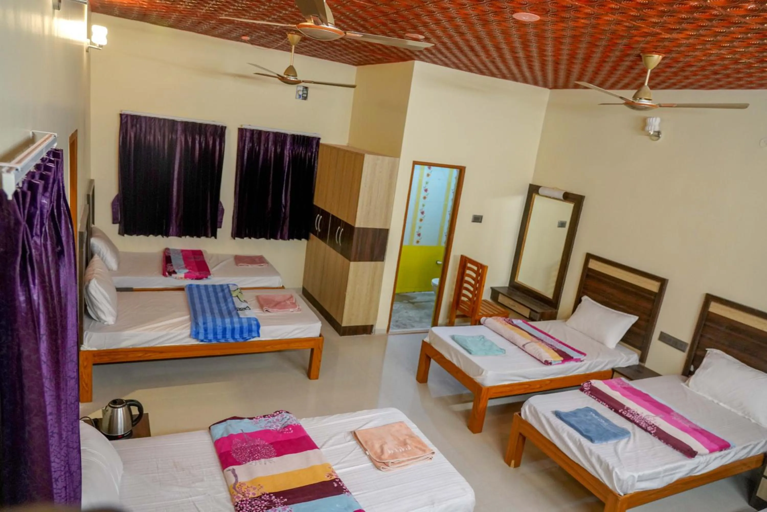 Bed in Bhavan Resorts