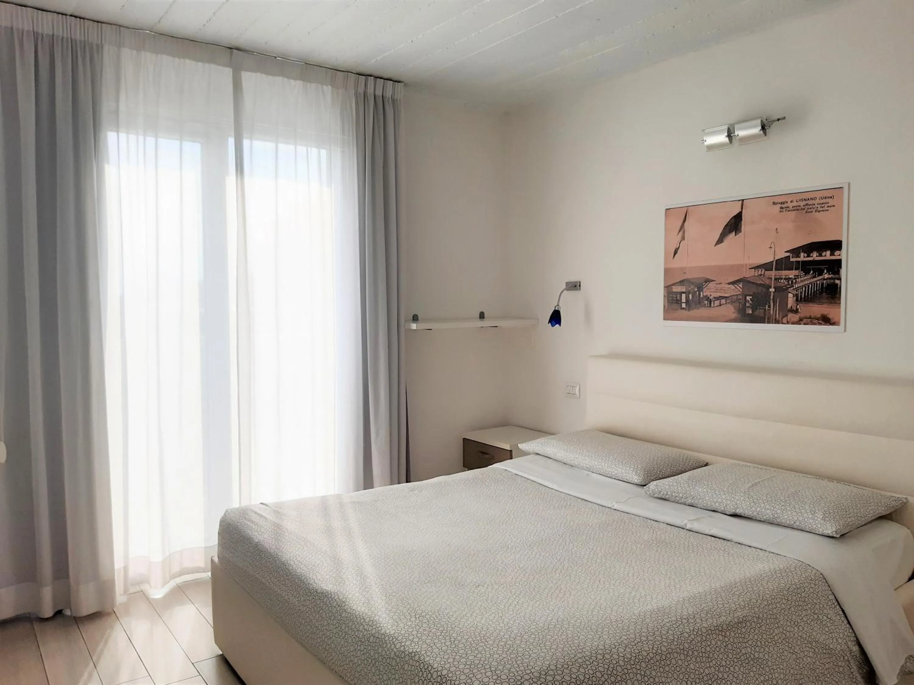 Bed in Appart-Hotel Holiday