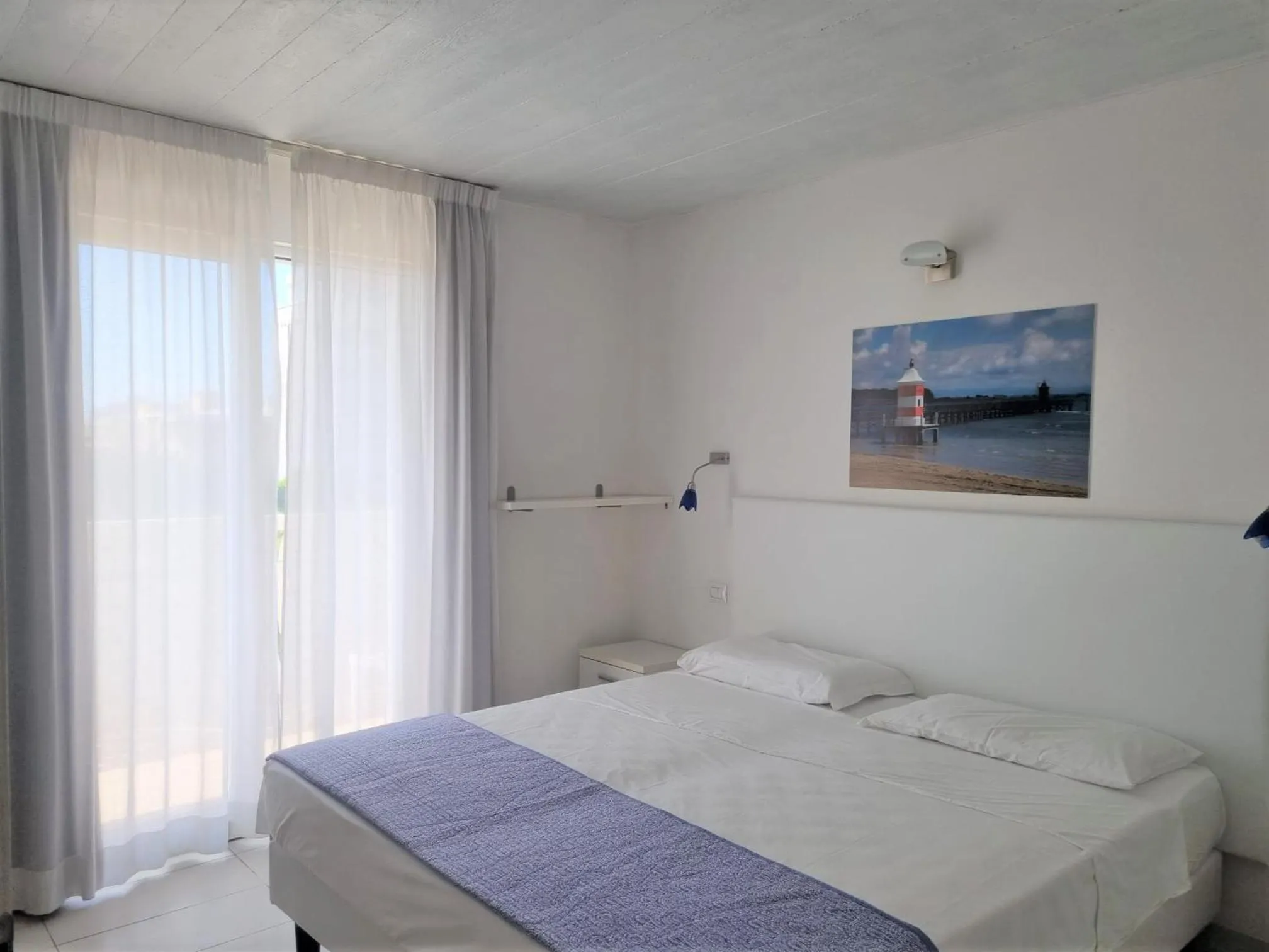 Bed in Appart-Hotel Holiday