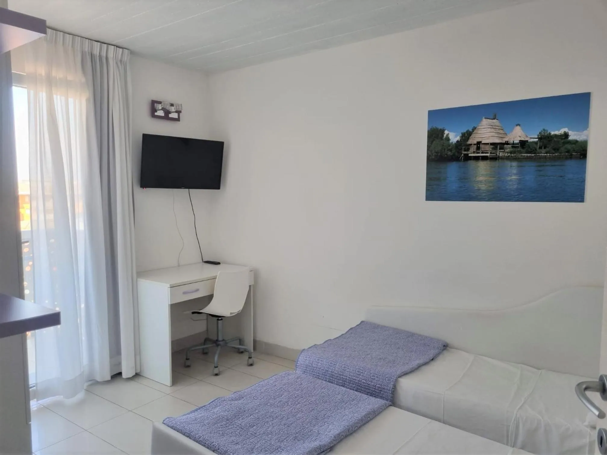 Bed in Appart-Hotel Holiday