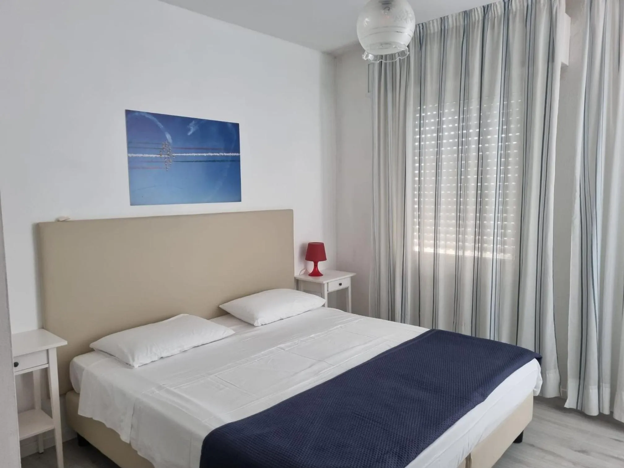 Bed in Appart-Hotel Holiday