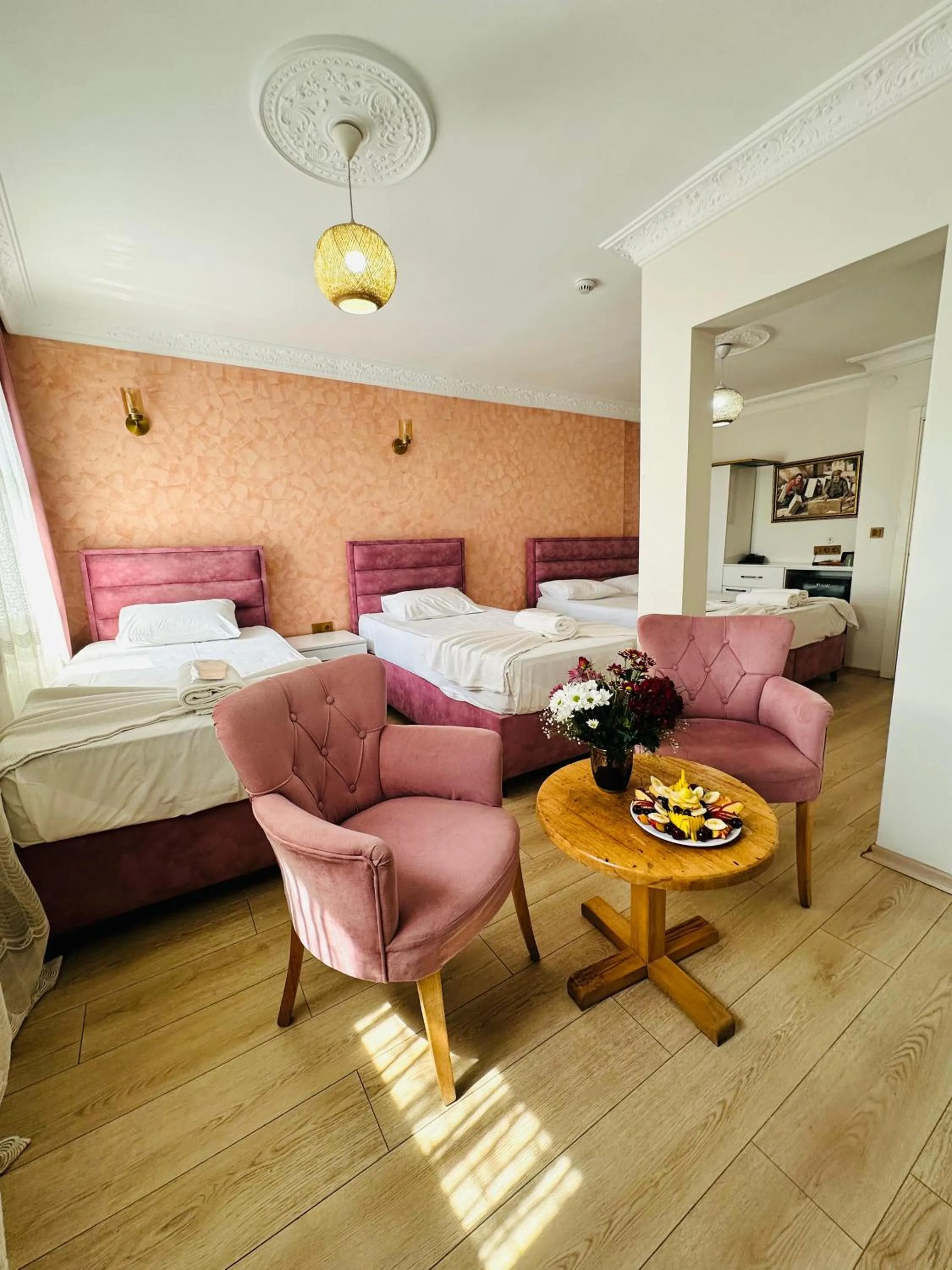 Bed in AVRASYAQUEEN HOTEL