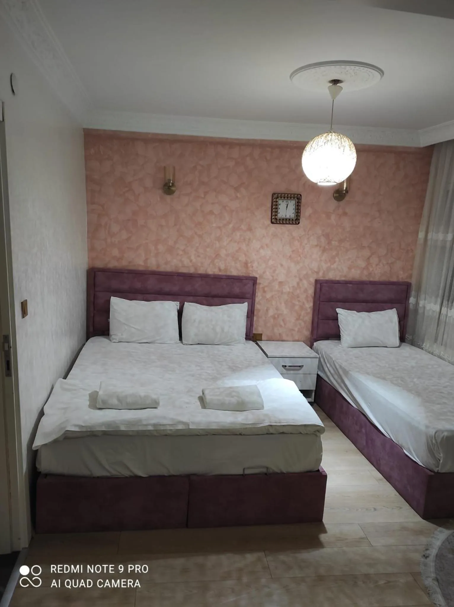 Bed in AVRASYAQUEEN HOTEL