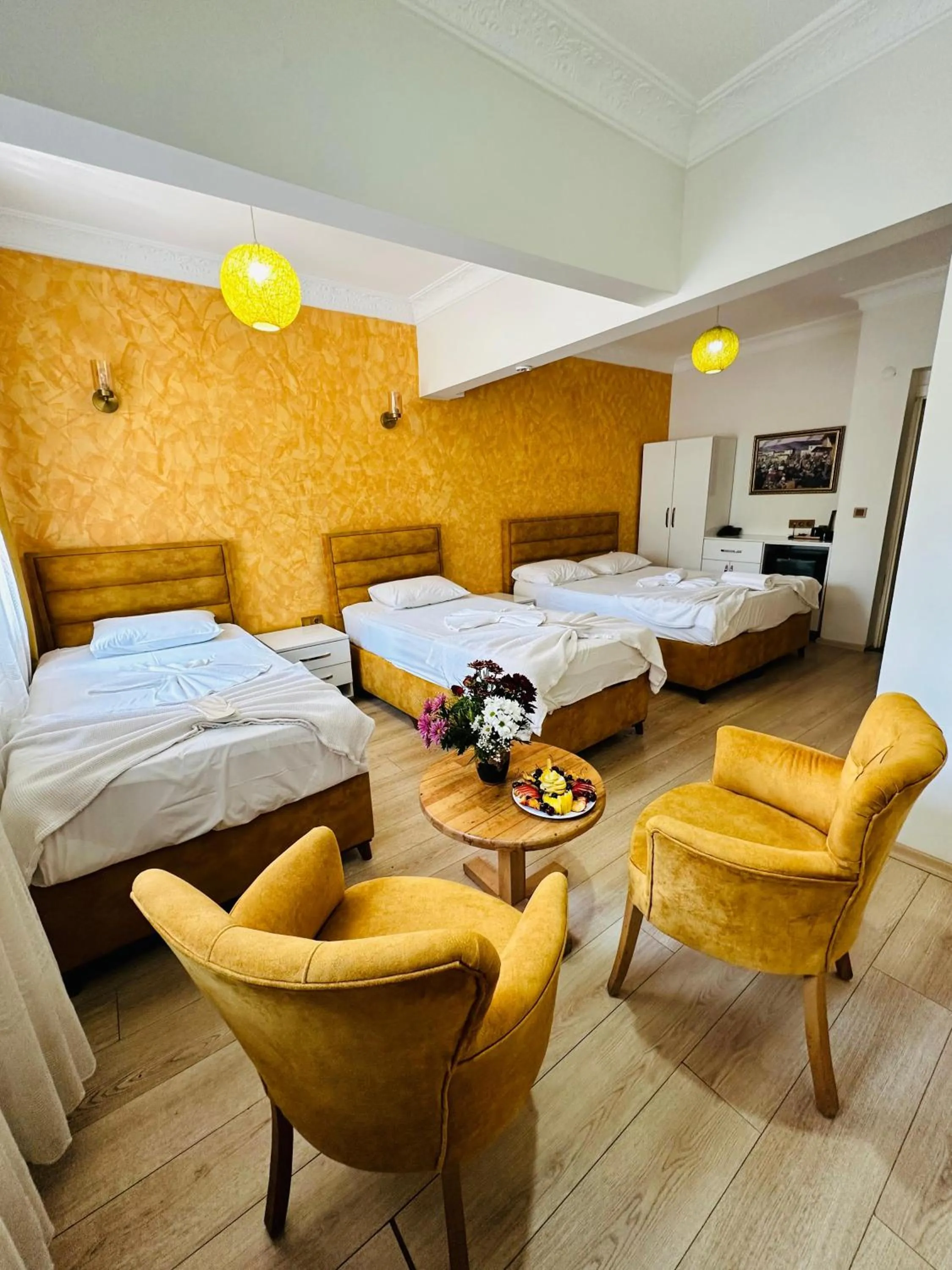 Bed in AVRASYAQUEEN HOTEL