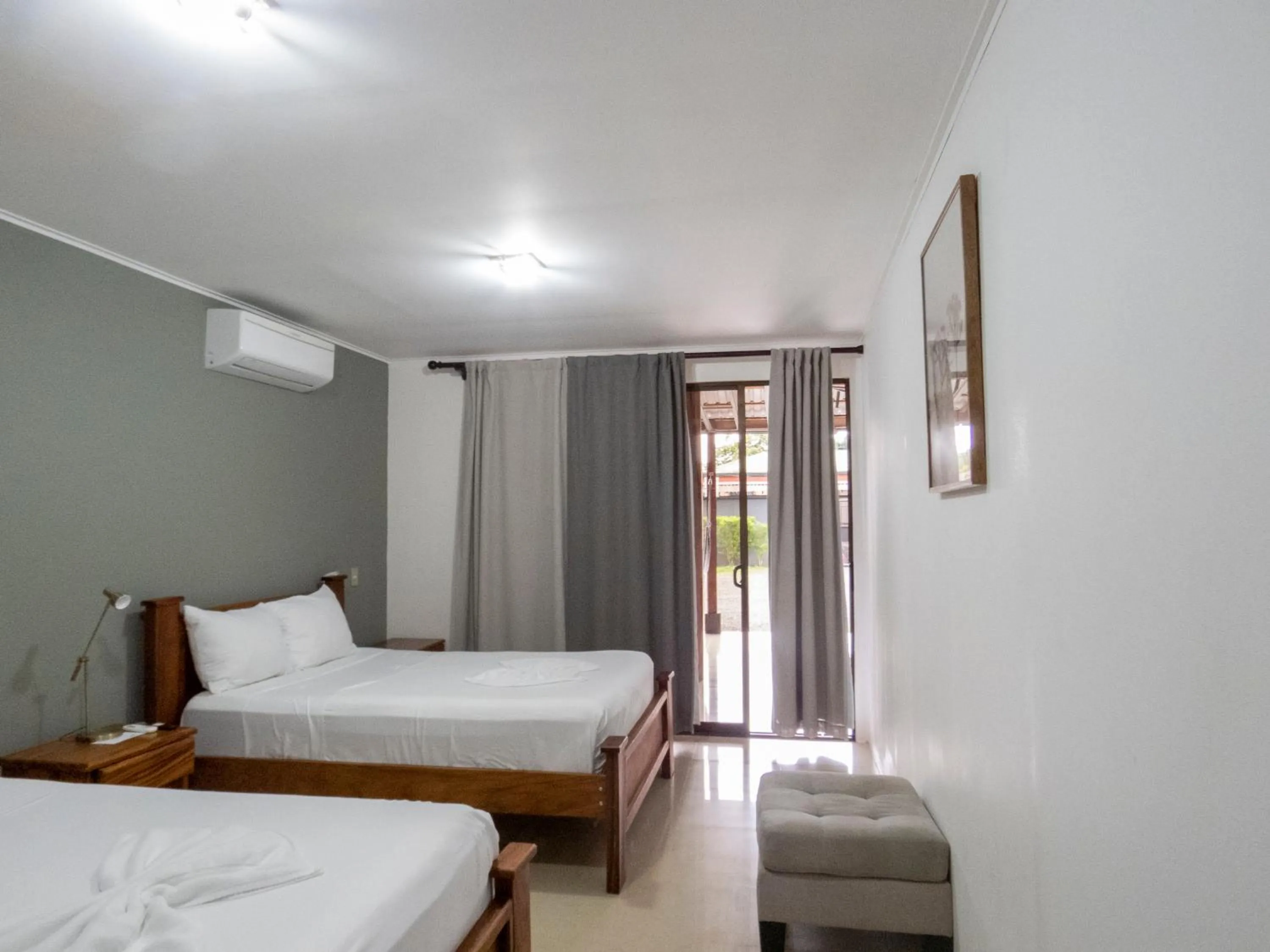 Bed in Coati Arenal Lodge