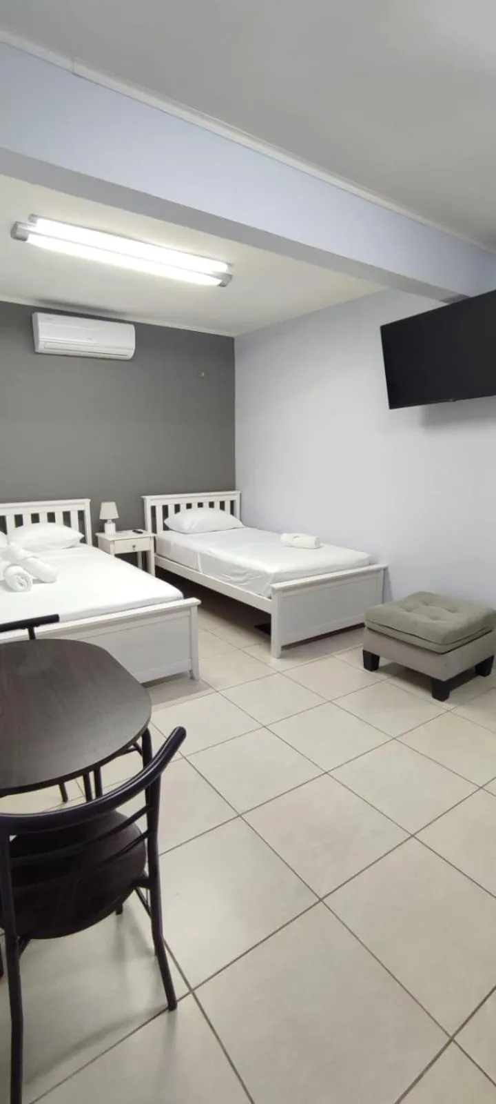 Bed in Coati Arenal Lodge