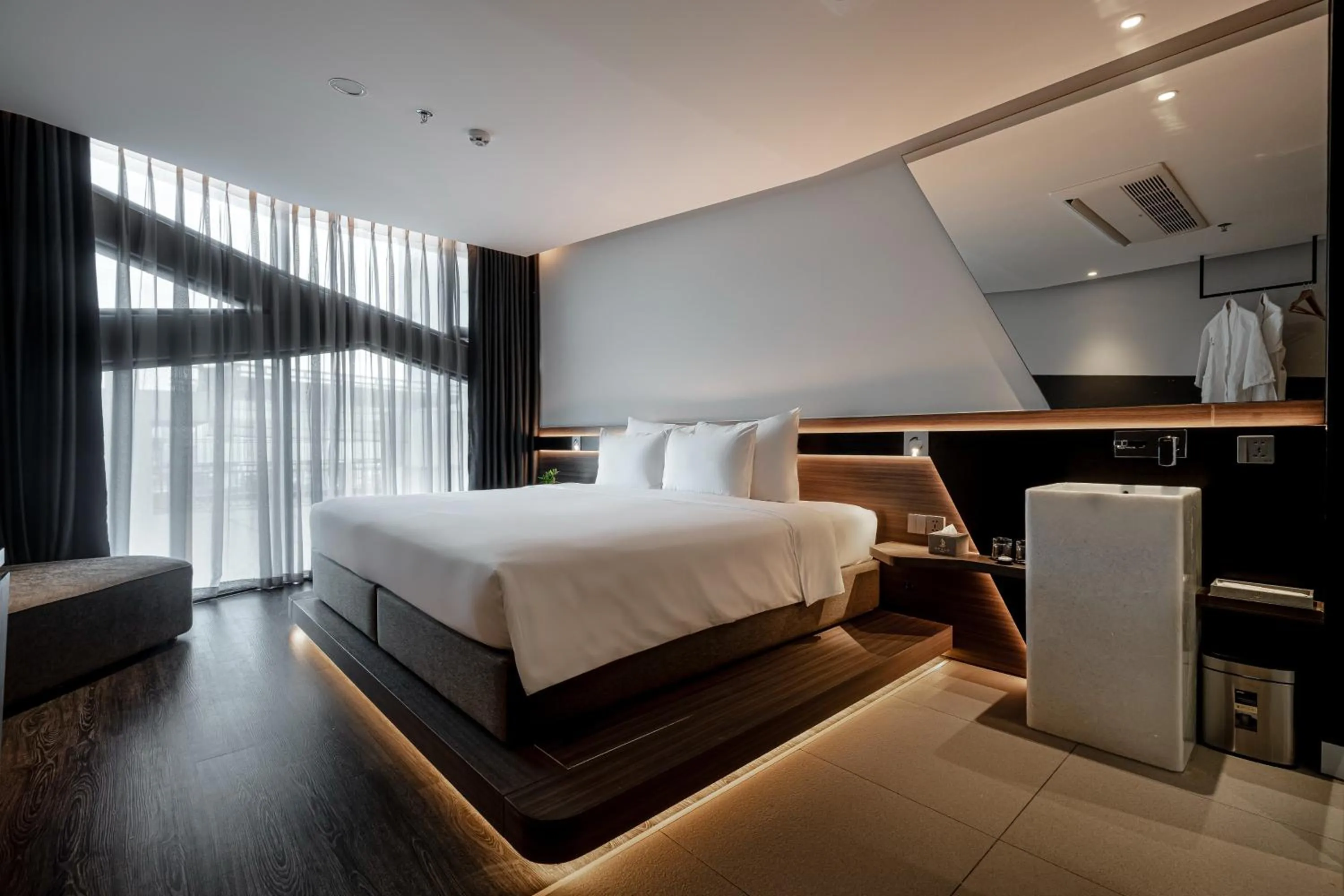 Bed in Draco Hotel & Suites