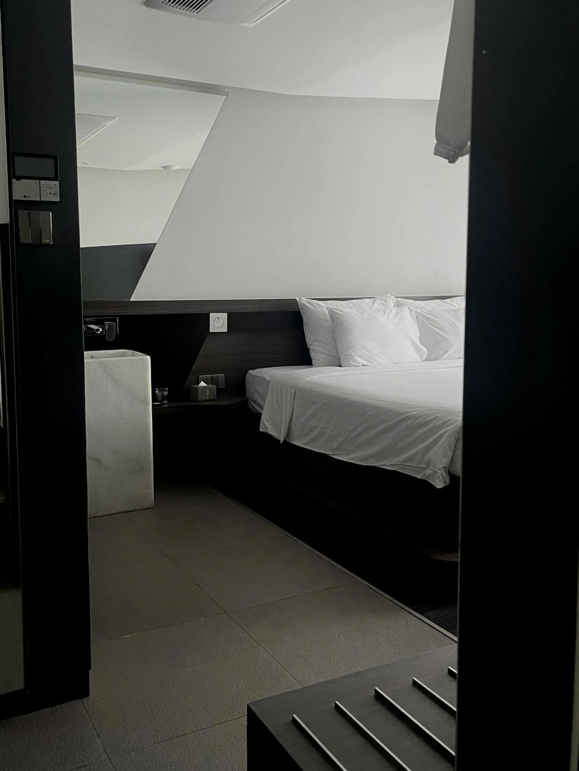 Bed in Draco Hotel & Suites