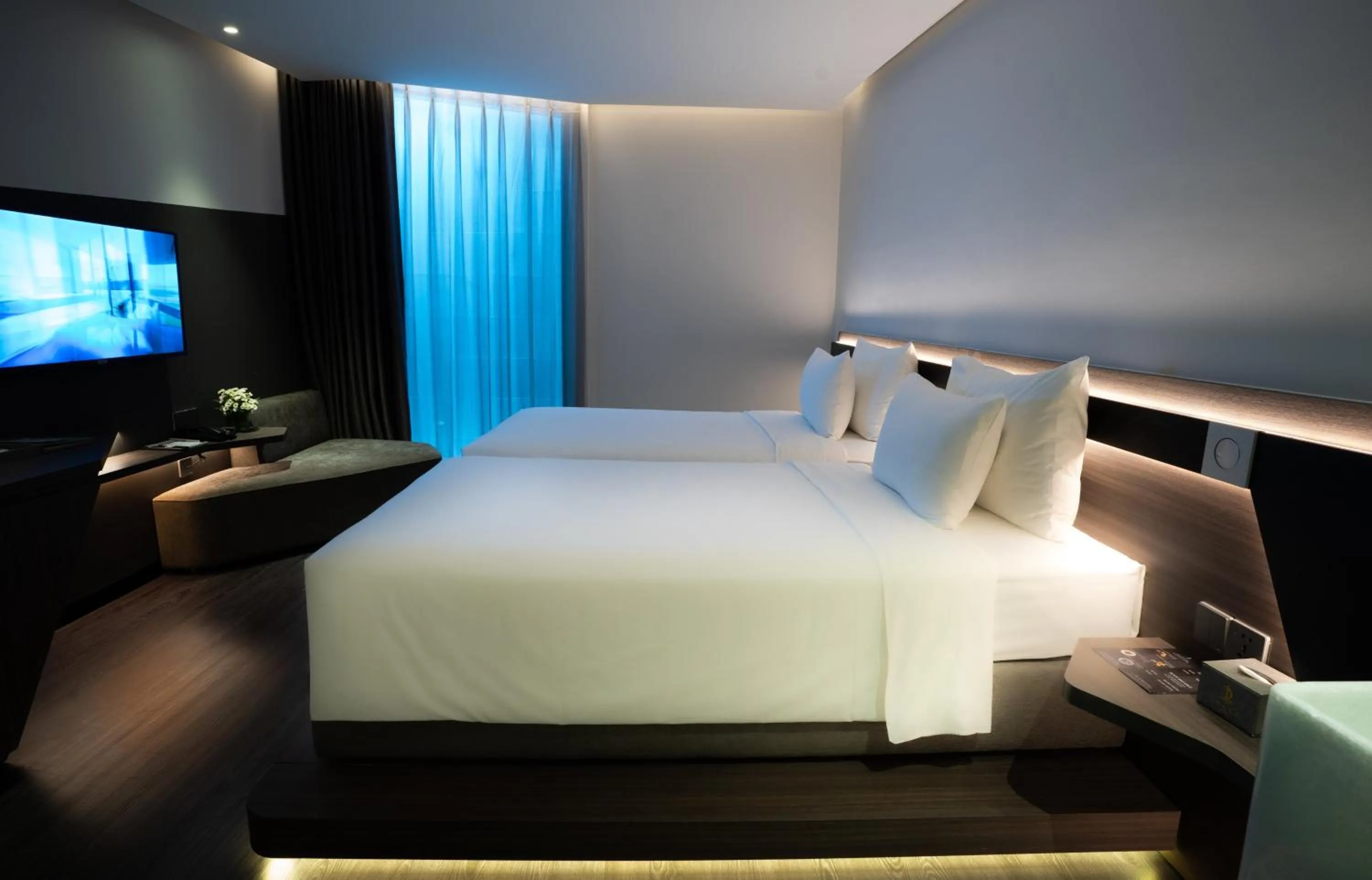 Bed in Draco Hotel & Suites