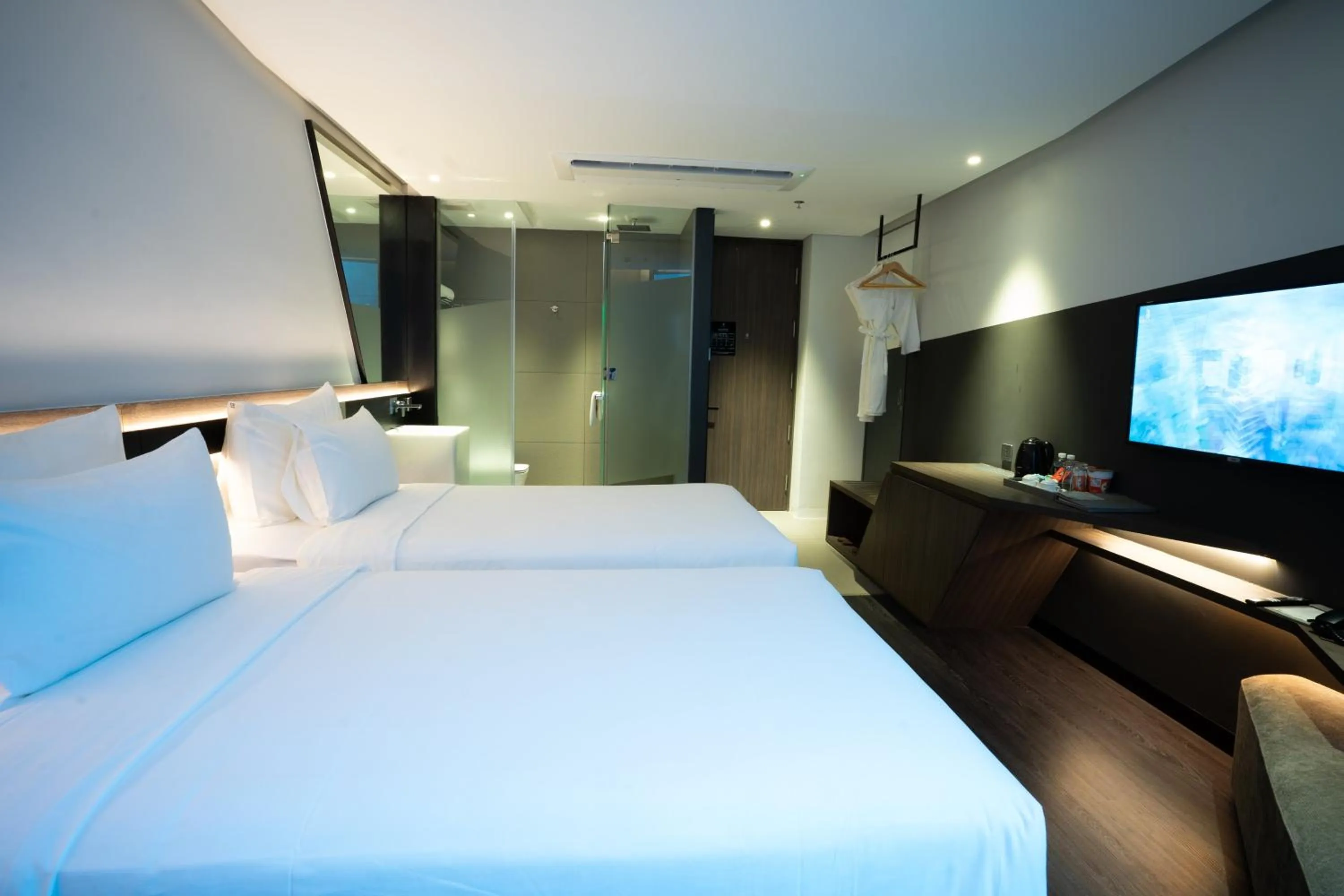 Bed in Draco Hotel & Suites