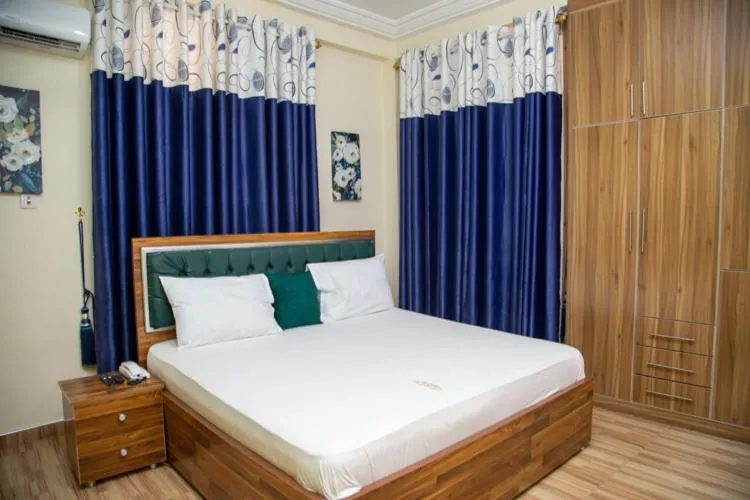 Bed in Macoba Luxury Apartments