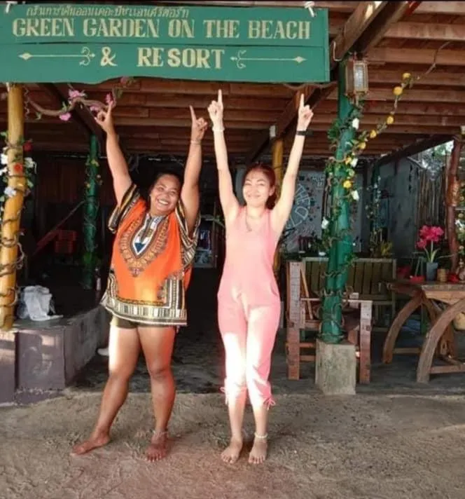 People in Green Garden Bungalows