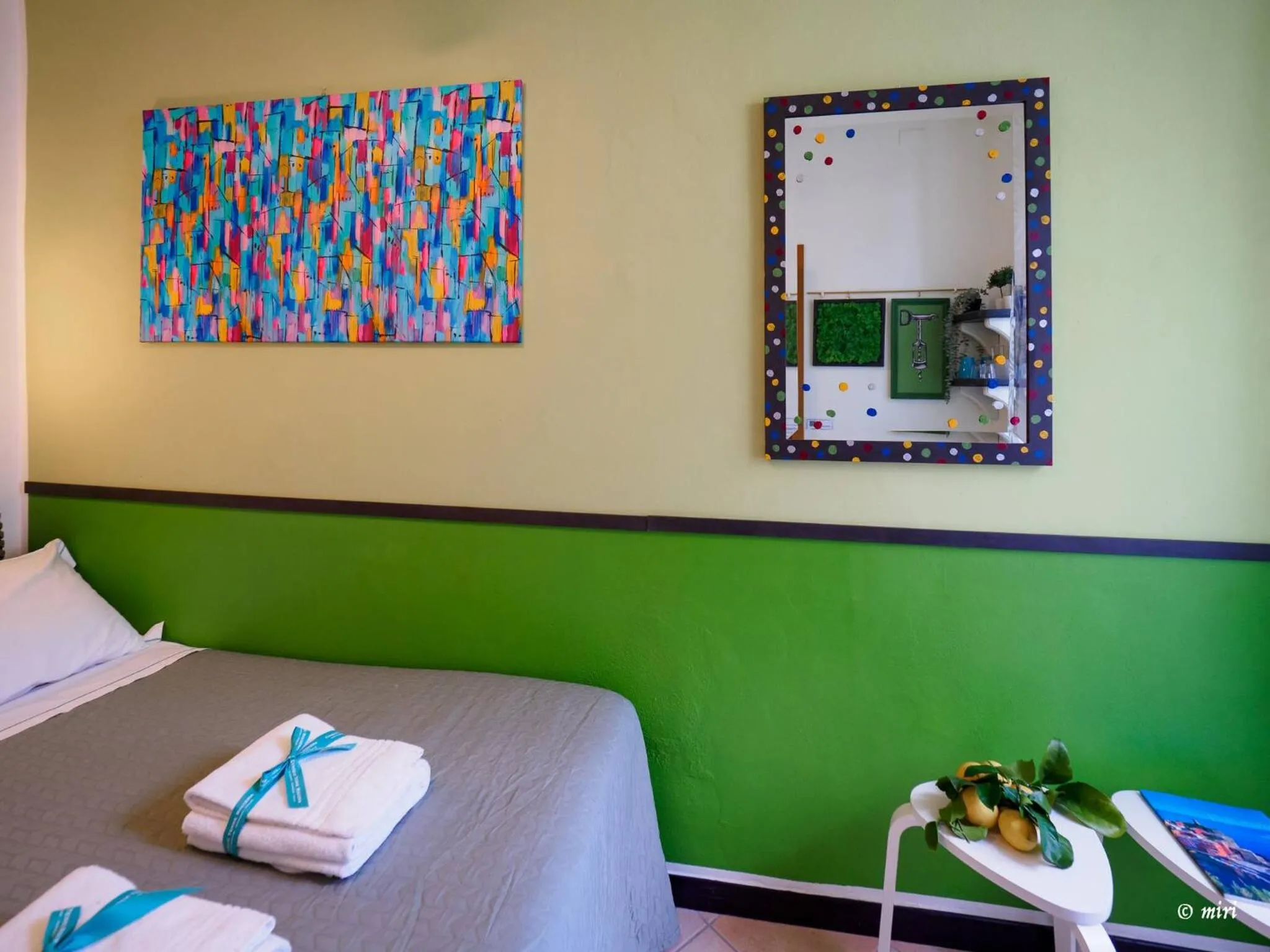 Bed in Carmelina Tiny Village Room