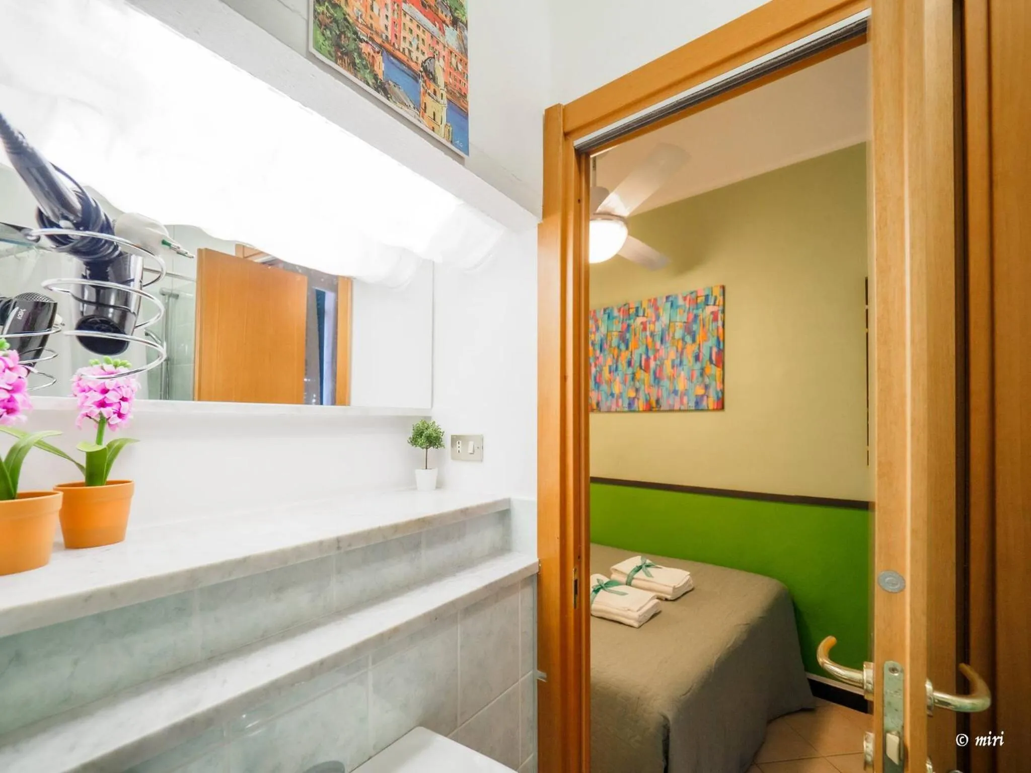 Bed in Carmelina Tiny Village Room