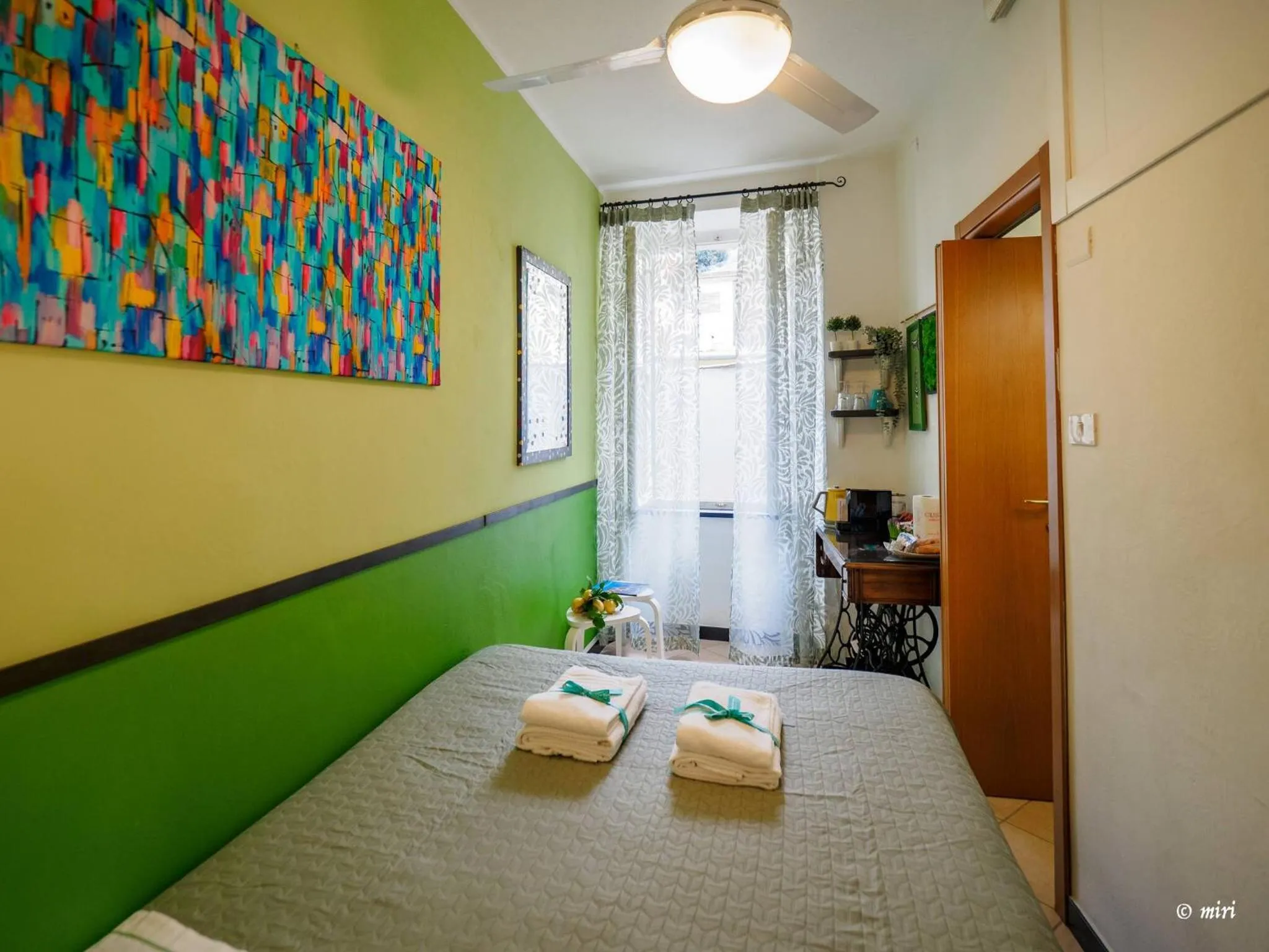 Bed in Carmelina Tiny Village Room