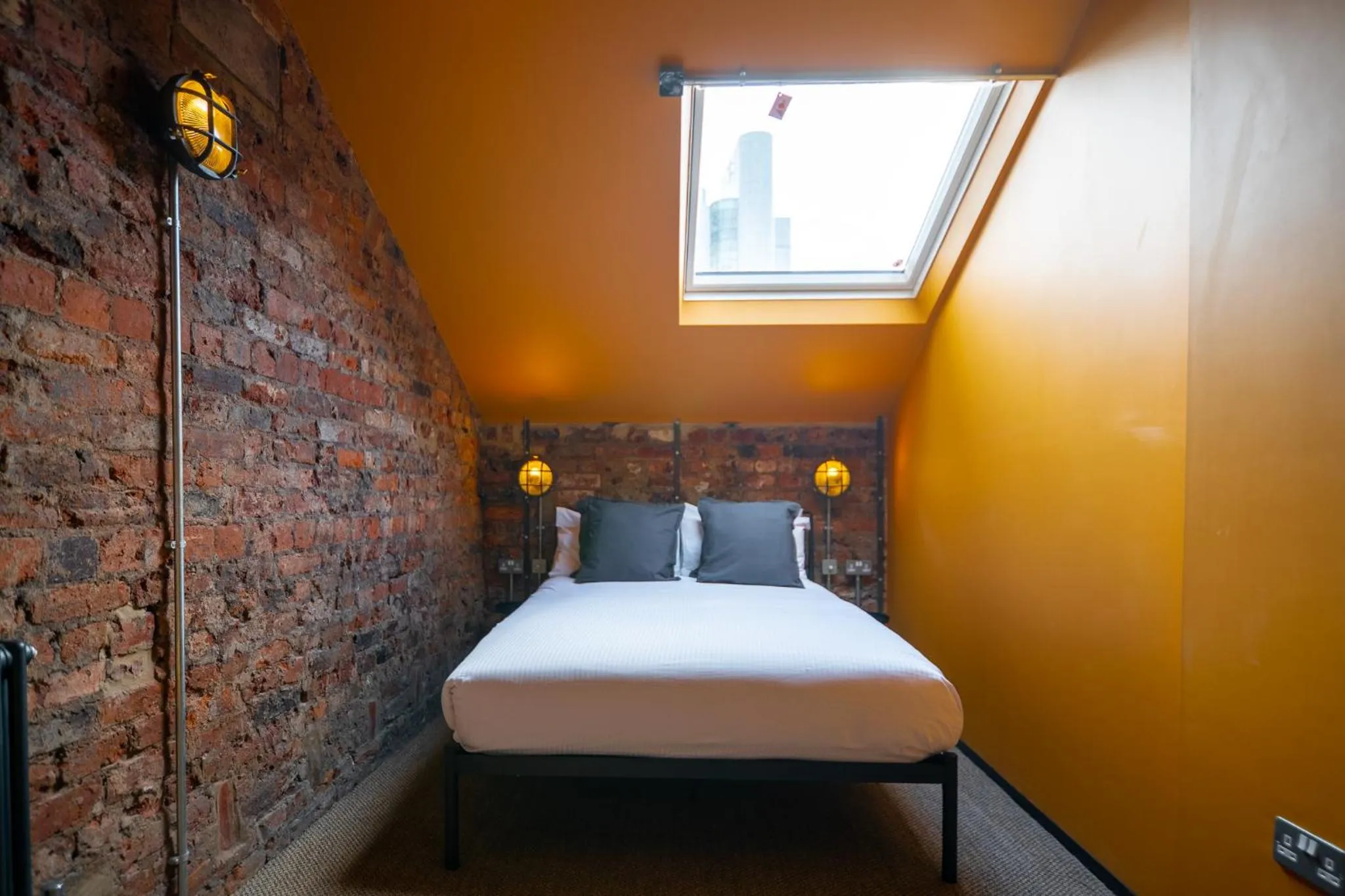 Bed in Rooms by Green Room