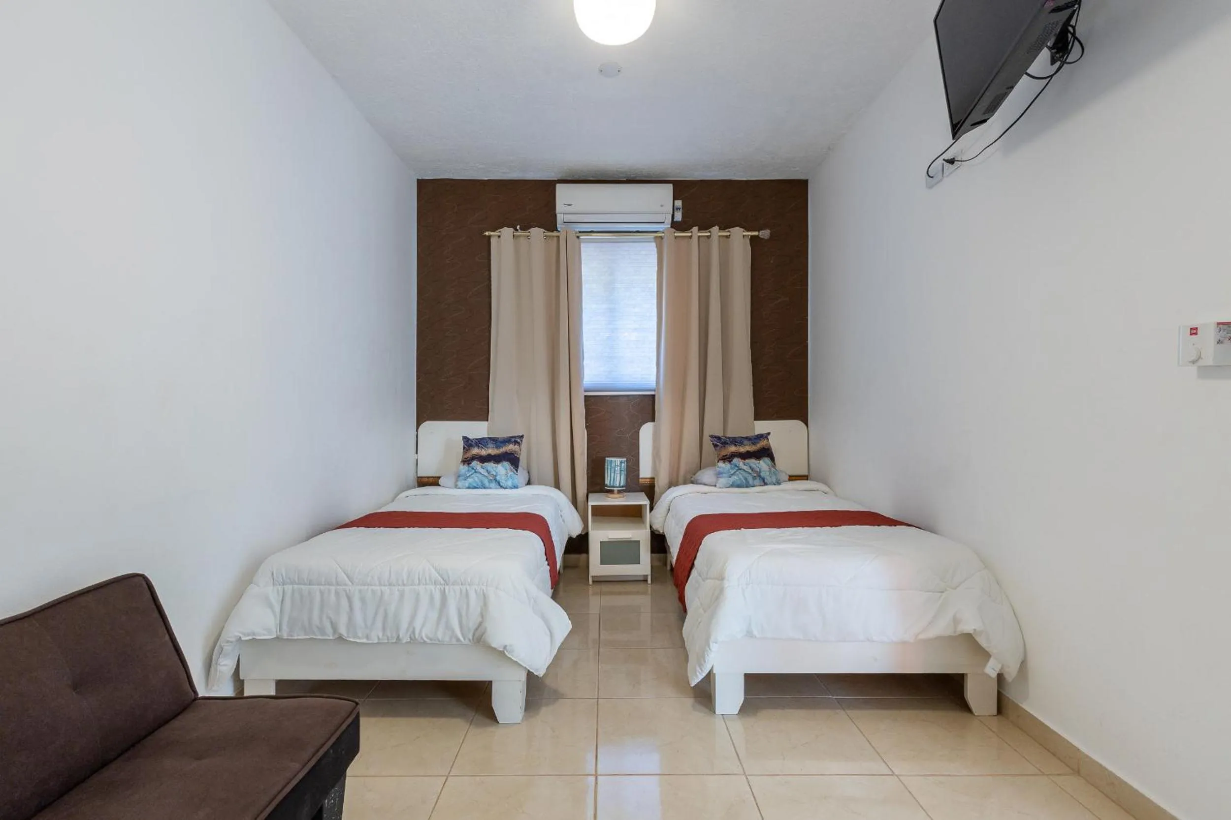 Bed in EDMA APARTAHOTEL