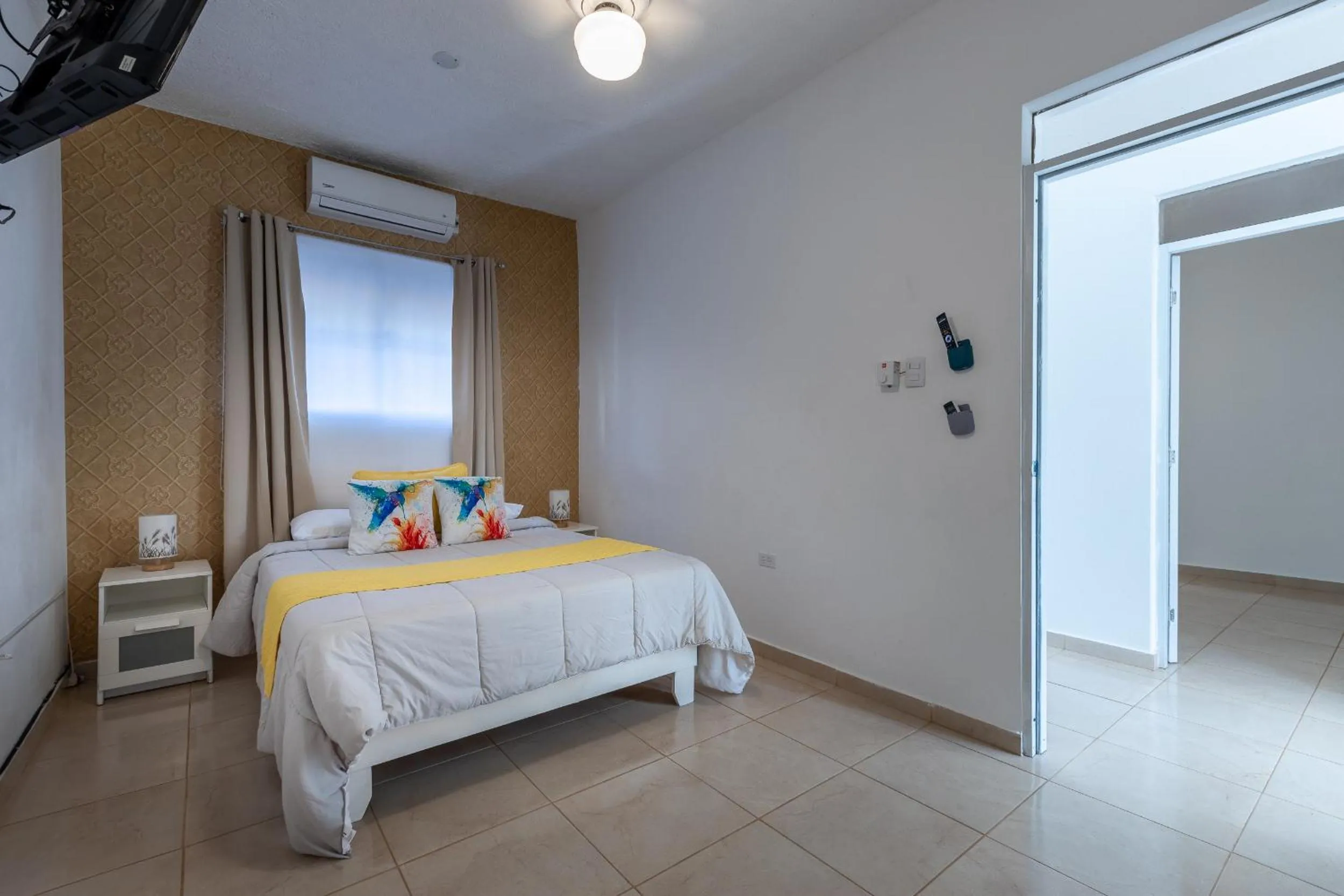 Bed in EDMA APARTAHOTEL