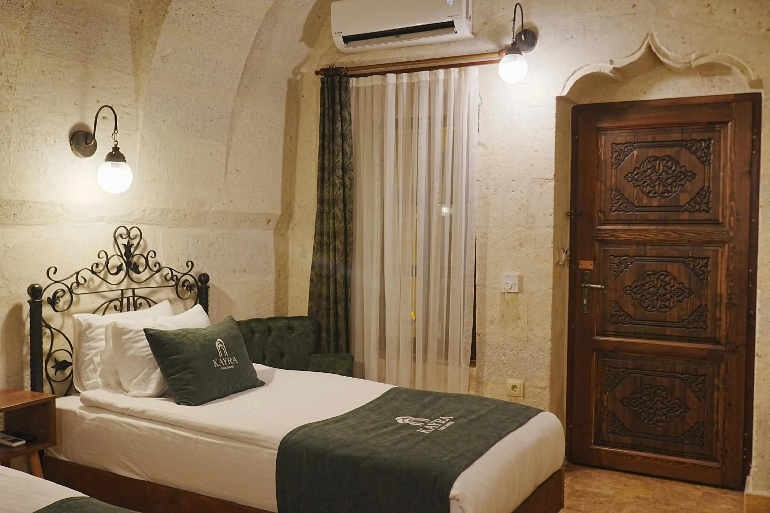 Bed in Kayra Cave Suites